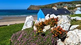 Port Erin. Das malerische Fischerdorf gilt als Perle des Südens. Im Hintergrund der 1871 erbaute Milner’s Tower.
