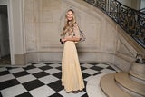 Front Row statt Laufsteg: Das Topmodel bei der Dior Fashion-Show in Paris.
