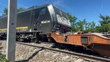Güterzug gegen Bagger