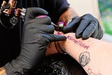 Gewessler beim Frequency: Für Klima-Tattoo gab's Jahres-Öffi-Karte gratis