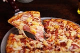 Kaum ein anderes Gericht sorgt für so viele Diskussionen wie die Pizza Hawaii