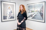 Mercedes Helnwein vor zwei ihrer Werke