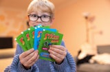 Grüne (pro 10 Euro-Einkaufswert) und blaue (0,50 Euro für 5 Sticker) Briefchen mit Stickern.
