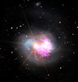 IC 1623 - Diese Aufnahme zeigt zwei verschmelzende Galaxien, in denen durch die Kollision neue Sterne entstehen und möglicherweise ein supermassereiches Schwarzes Loch gebildet wird.&nbsp;