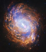 NGC 1068 – eine aktive Galaxie. In ihrer Mitte befindet sich ein Schwarzes Loch. Aus dieser Region bläst heißes Material mit einer Geschwindigkeit von rund 1,6 Millionen Kilometern pro Stunde ins All.&nbsp;