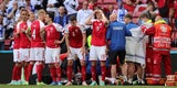Dänemarks Eriksen liegt bewusstlos am Boden, wird behandelt - Teamkollegen bilden einen Sichtschutz
