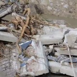 Unwetter-Flut spült Friedhof frei