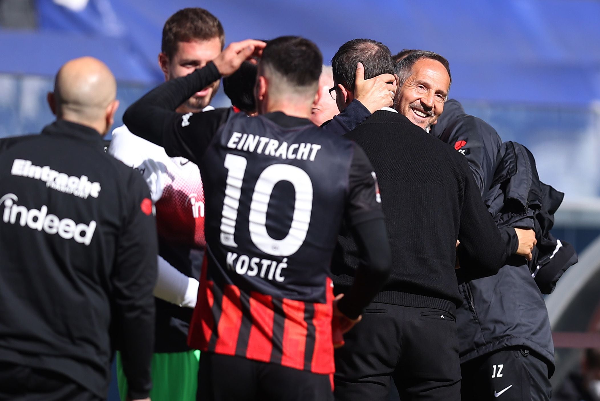 FRANKFURT AM MAIN, GERMANY - MAY 22: Adi Huetter, Head Coach of Eintracht Frankfurt interacts with Fredi Bobic, Sporting Director of Eintracht Frankfurt following the Bundesliga match between Eintracht Frankfurt and Sport-Club Freiburg at Deutsche Bank Park on May 22, 2021 in Frankfurt am Main, Germany. Sporting stadiums around Germany remain under strict restrictions due to the Coronavirus Pandemic as Government social distancing laws prohibit fans inside venues resulting in games being played behind closed doors. (Photo by Alex Grimm/Getty Images)