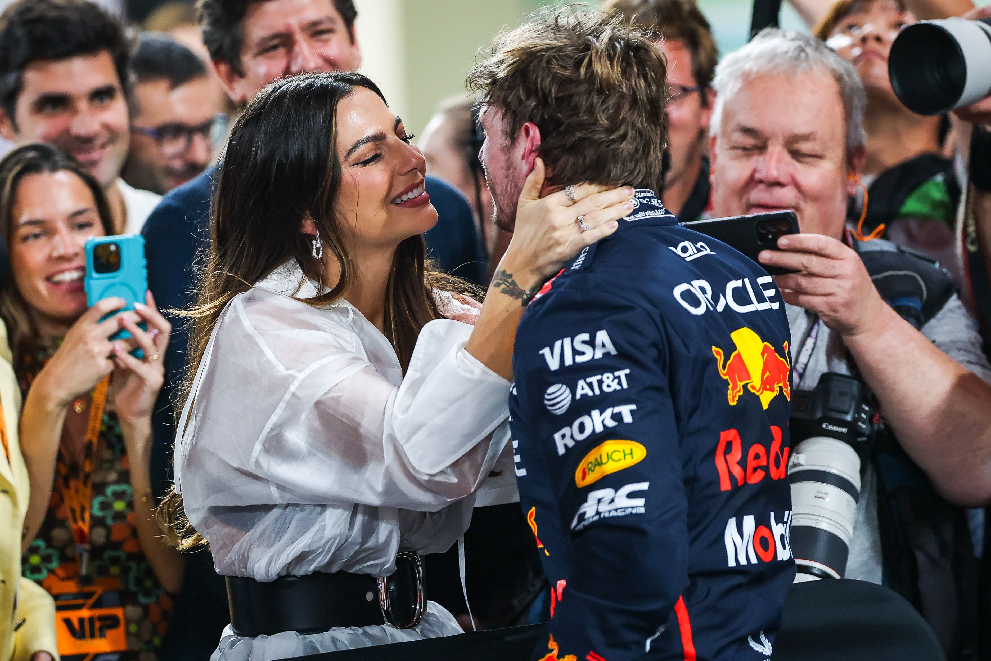 ABU DHABI, UNITED ARAB EMIRATES - DECEMBER 6: Max Verstappen of the Netherlands and Oracle Red Bull Racing celebrates in parc ferme with Kelly Piquet during qualifying ahead of the F1 Grand Prix of Abu Dhabi at Yas Marina Circuit on December 6, 2025 in Abu Dhabi, United Arab Emirates. (Photo by Kym Illman/Getty Images)