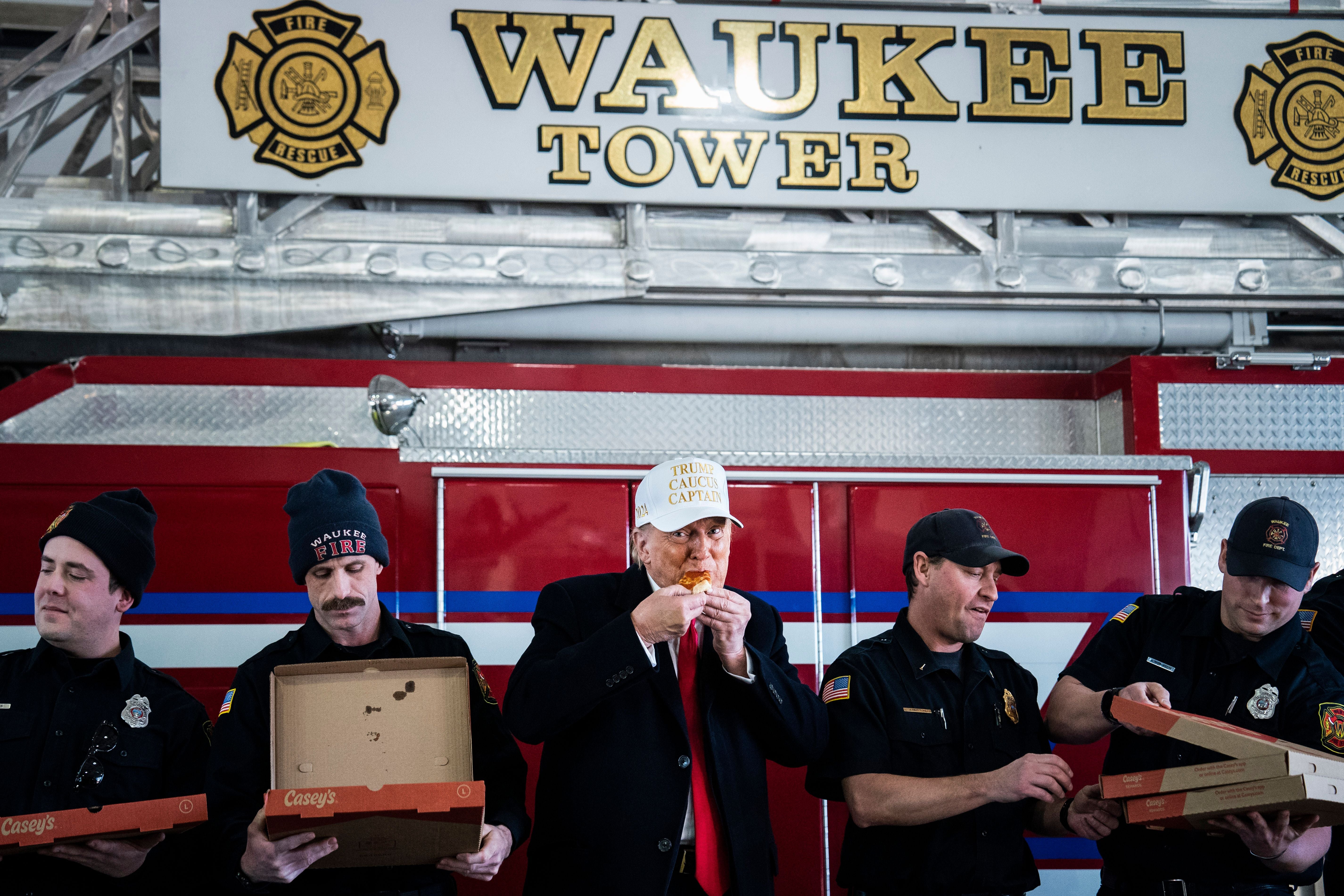 Waukee, IA - January 14 : Republican presidential candidate former president Donald Trump delivers to and eats pizza with fire fighters at the Waukee Fire Department in Waukee, Iowa on Sunday, January 14, 2023. (Photo by Jabin Botsford/The Washington Post via Getty Images)