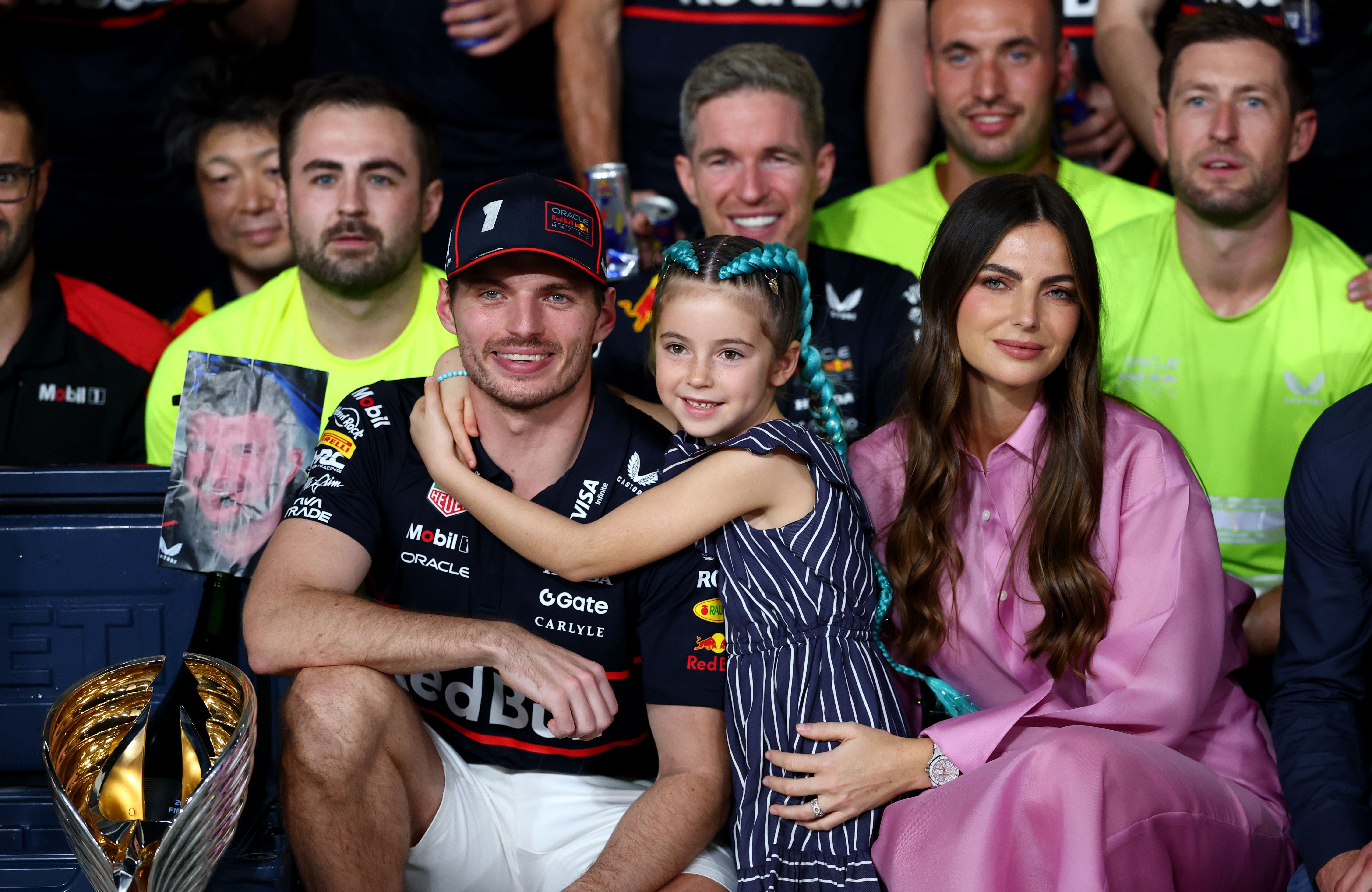 ABU DHABI, UNITED ARAB EMIRATES - DECEMBER 07: Race winner Max Verstappen of the Netherlands and Oracle Red Bull Racing celebrates with his team, Kelly Piquet and Penelope Piquet during the F1 Grand Prix of Abu Dhabi at Yas Marina Circuit on December 07, 2025 in Abu Dhabi, United Arab Emirates. (Photo by Clive Rose/Getty Images)