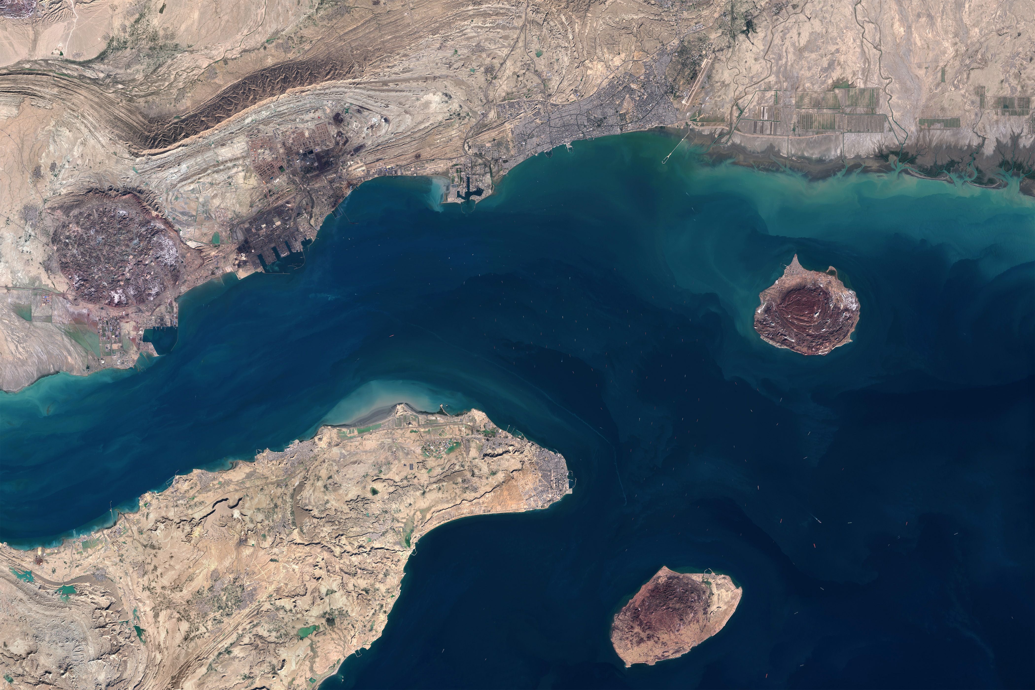 STRAIT OF HORMUZ - 17 JANUARY 2026: A satellite view of Bandar Abbas, Qeshm Island, Larak Island, and Hormuz Island in Hormozgan Province, within the Strait of Hormuz region, an energy chokepoint and strategic shipping corridor on January 17, 2026. Bandar Abbas, Iran’s largest port, manages oil and gas exports, maritime trade, and naval operations, with ships awaiting at anchorage before entering vital global shipping routes. (Photo by Gallo Images/Orbital Horizon/Copernicus Sentinel Data 2026)