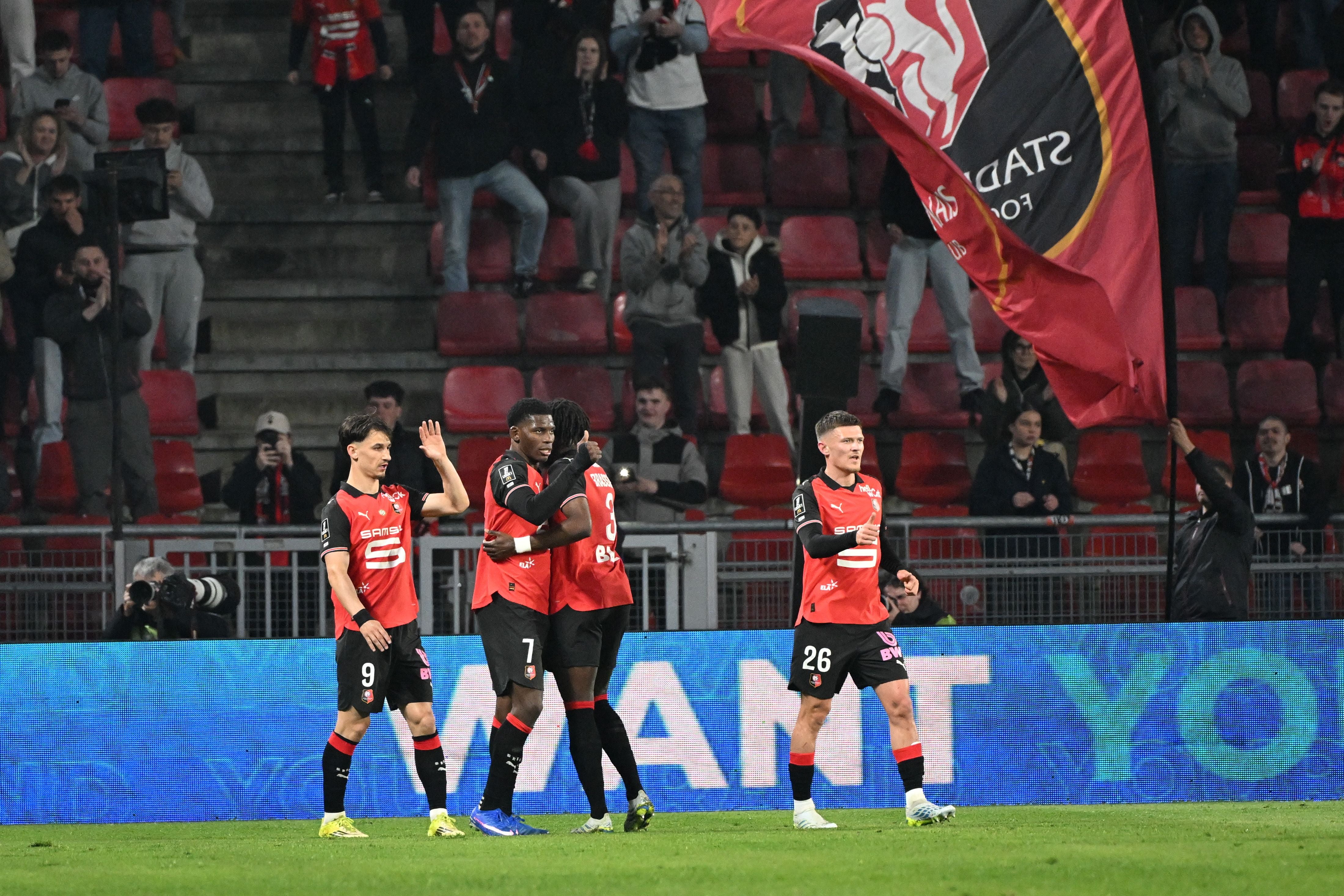 (LtoR) Rennes' French forward #9 Esteban Lepaul, Swiss forward #7 Breel Embolo, French defender #3 Lilian Brassier and French defender #26 Quentin Merlin (R) celebrate their team's second goal during the French L1 football match between Rennes and Angers at Roazhon Park stadium in Rennes on April 11, 2026. (Photo by Sebastien Salom-Gomis / AFP)