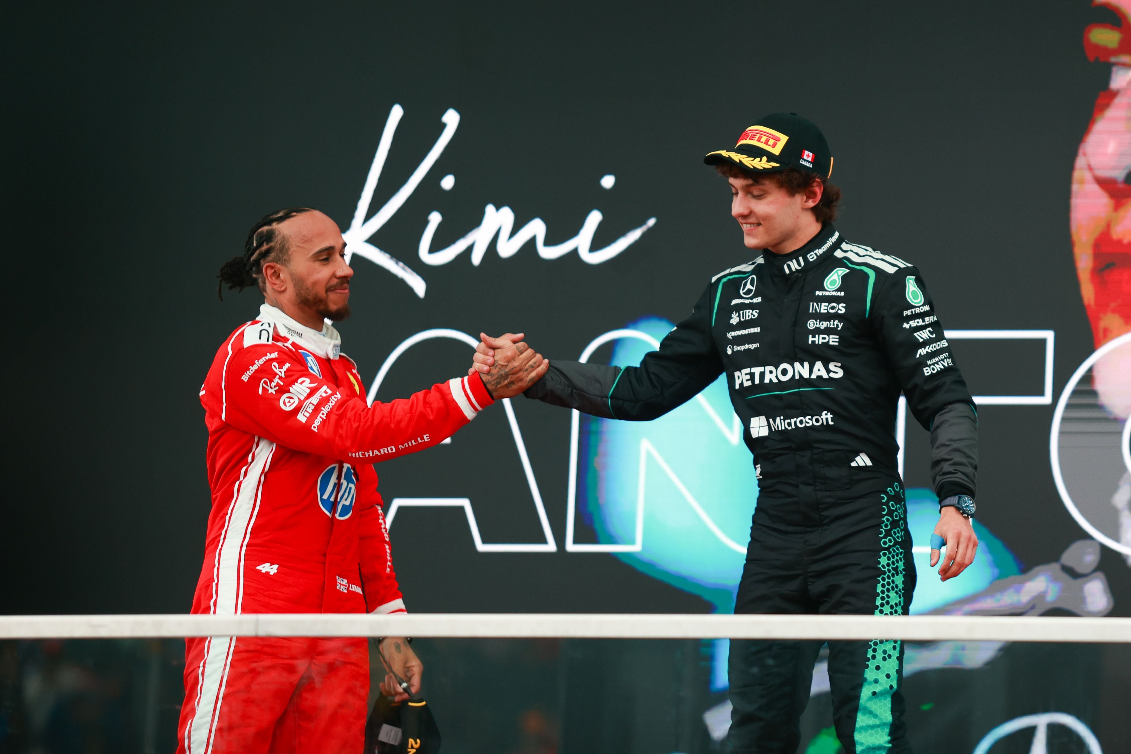 Lewis Hamilton and Kimi Antonelli celebrate on the podium after placing first in the Formula 1 Lenovo Grand Prix du Canada at the Circuit Gilles Villeneuve in Montreal, Quebec, Canada, on May 24, 2026. (Photo by Reginald Mathalone/NurPhoto via Getty Images)