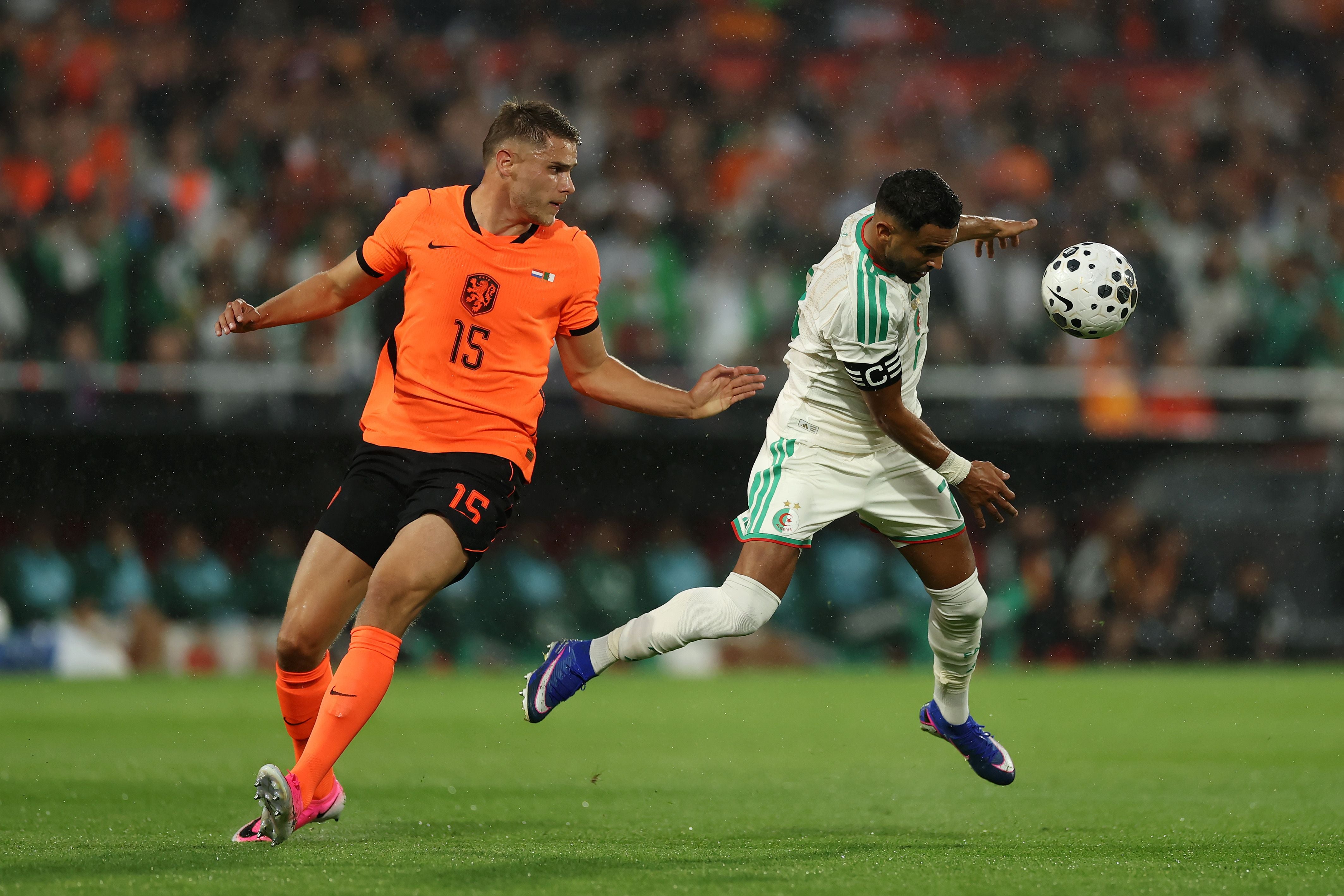 ROTTERDAM, NETHERLANDS - JUNE 03: Riyad Mahrez of Algeria is challenged by Micky van de Ven of Netherlands during the international friendly match between Netherlands and Algeria at De Kuip on June 03, 2026 in Rotterdam, Netherlands. (Photo by Dean Mouhtaropoulos/Getty Images)