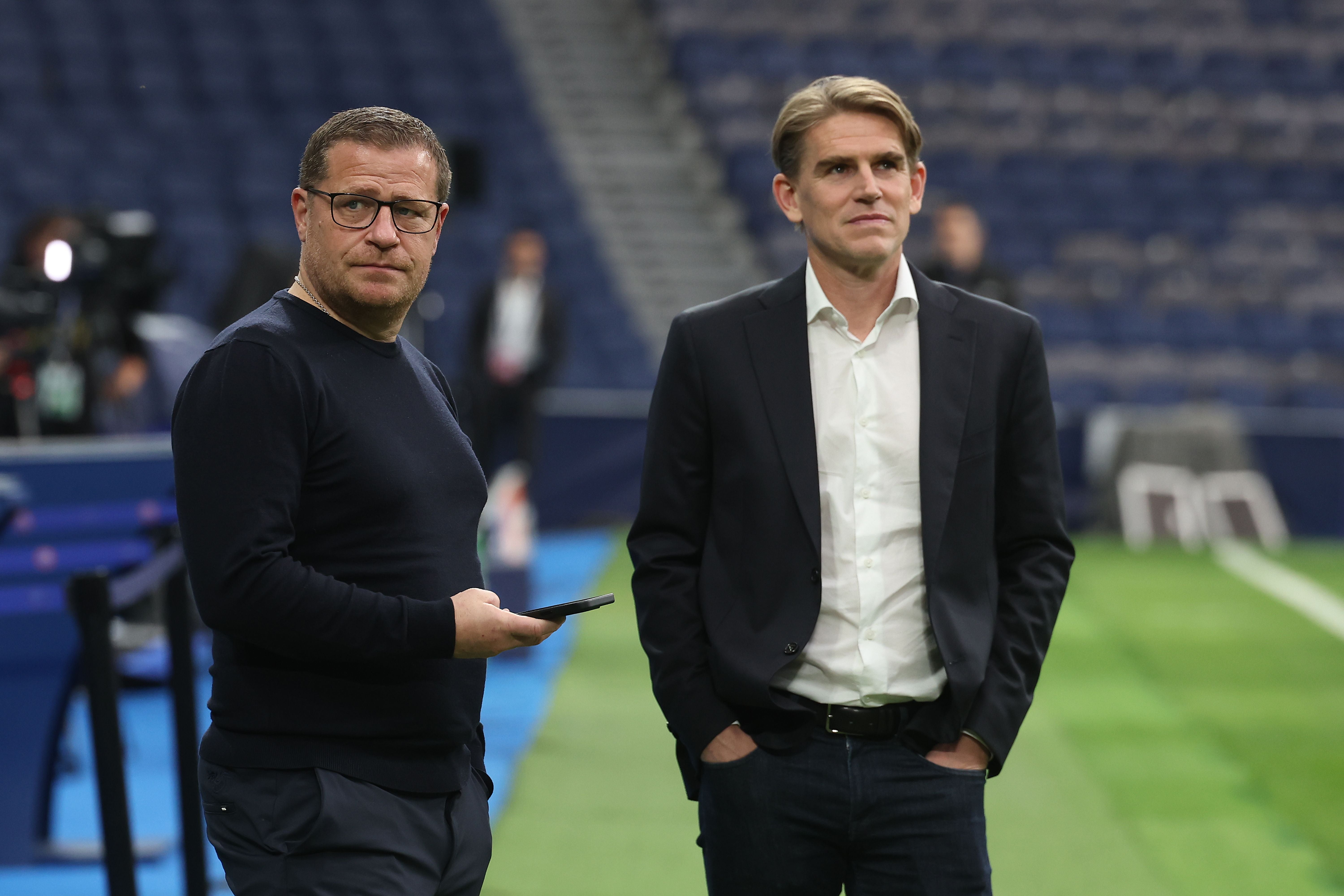 MADRID, SPAIN - MAY 07: Max Eberl (L), Board Member for Sport FC Bayern München talks to Christoph Freund, Sporting Director of Bayern Munich ahead of their UEFA Champions League semi-final second leg match against Real Madrid at Estadio Santiago Bernabeu on May 07, 2024 in Madrid, Spain. (Photo by Alexander Hassenstein/Getty Images)