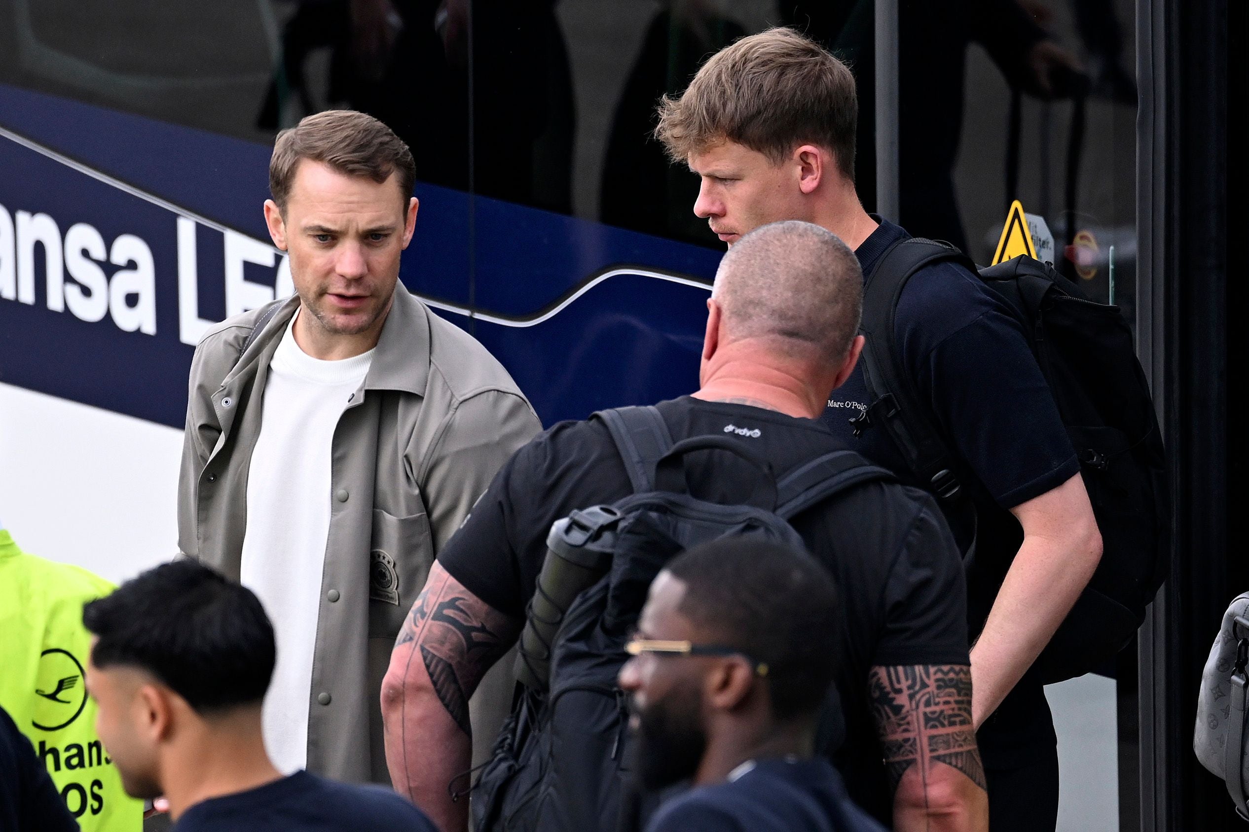 FRANKFURT AM MAIN, GERMANY - JUNE 02: The goalkeeper Manuel Neuer (L) and Alexander Nübel (R) chat prior to the departure of Team Germany to the FIFA World Cup 2026 at Frankfurt International Airport on June 02, 2026 in Frankfurt am Main, Germany. Germany will fly into Chicago to have some training sessions, fan and media activities and an international friendly match against the US Men's Soccer Team. After that the team will conclude the journey by travelling to North Carolina where the team will stay in the team base camp in Winston-Salem and travel from there to their group stage matches in Houston, Toronto and New Jersey. (Photo by Christian Kaspar-Bartke/Getty Images)