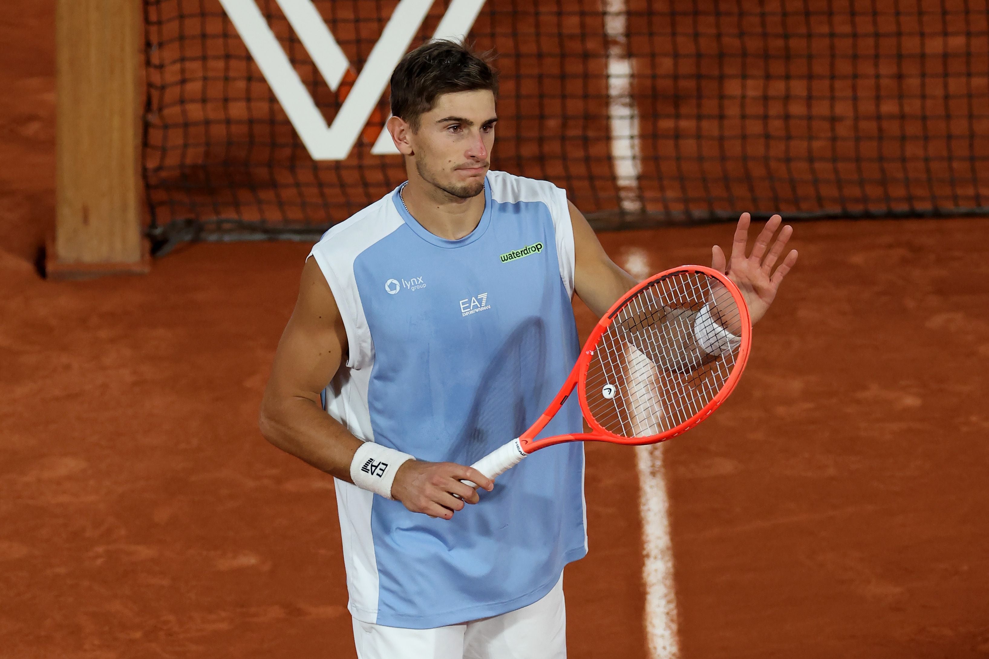 PARIS, FRANCE - JUNE 03: Matteo Arnaldi of Italy acknowledges the crowd as he takes victory after Matteo Berrettini of Italy retired with an injury during the Men's Singles quarter-final match on Day Eleven of the 2026 French Open at Roland Garros on June 03, 2026 in Paris, France. (Photo by Matthew Stockman/Getty Images)