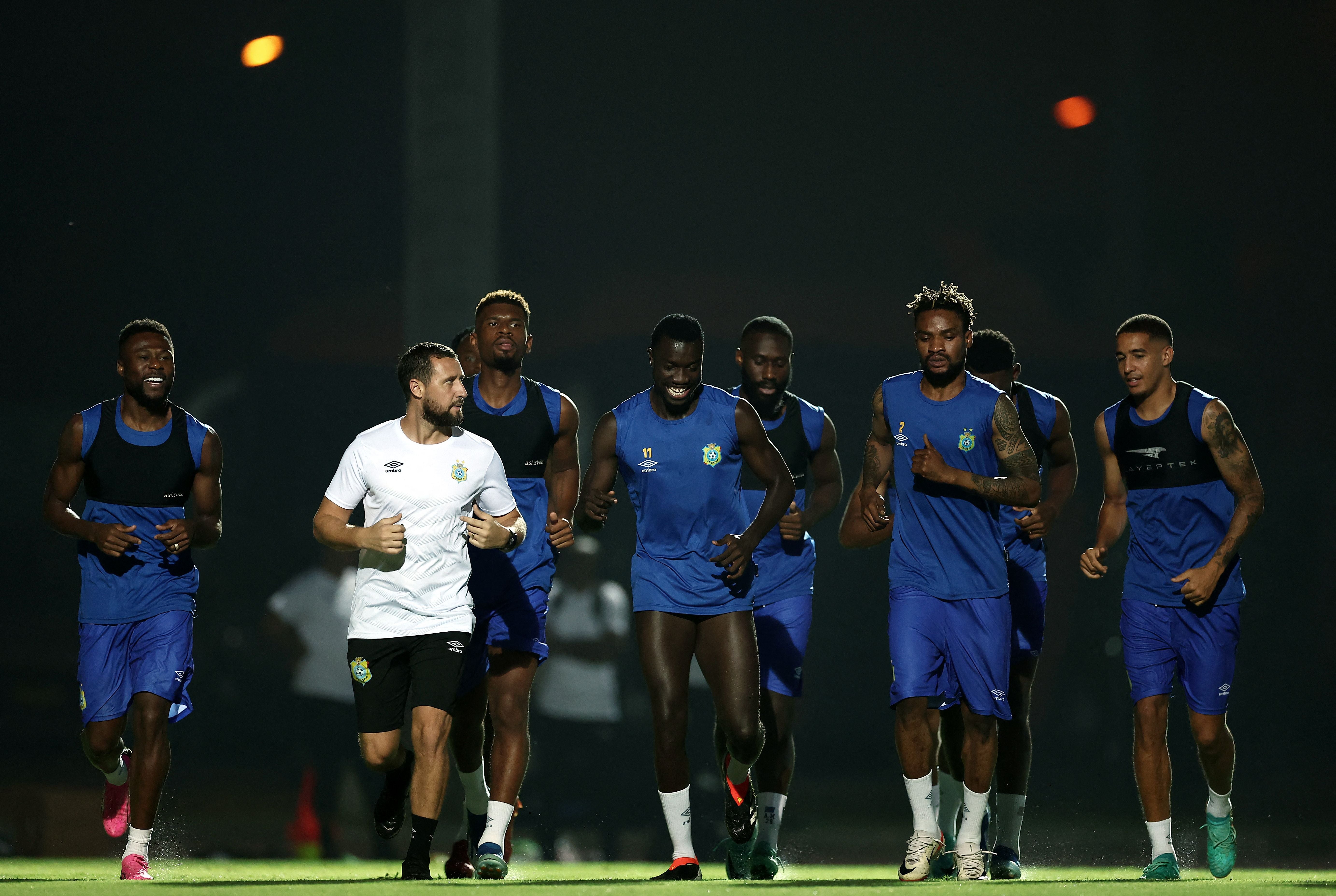 DR Congo's defender #22 Chancel Mbemba (L) and DR Congo's forward #11 Silas (C) attend a training session at the Injs Marcory stadium in Abidjan on February 6, 2024, on the eve of the 2024 Africa Cup of Nations (CAN) semi final football match between Ivory Coast and DR Congo. (Photo by FRANCK FIFE / AFP)