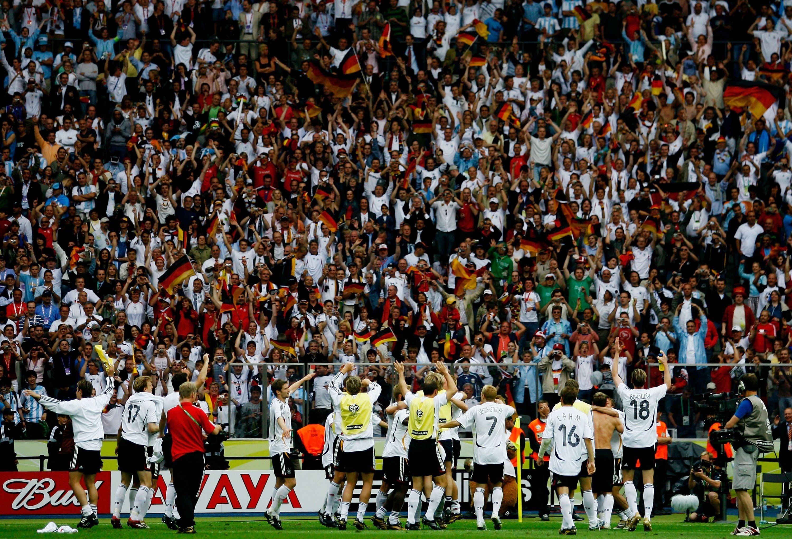 BERLIN - JUNE 30: The Germany players celebrate in front of their fans following their team's victory in a penalty shootout at the end of the FIFA World Cup Germany 2006 Quarter-final match between Germany and Argentina played at the Olympic Stadium on June 30, 2006 in Berlin, Germany. (Photo by Shaun Botterill/Getty Images)