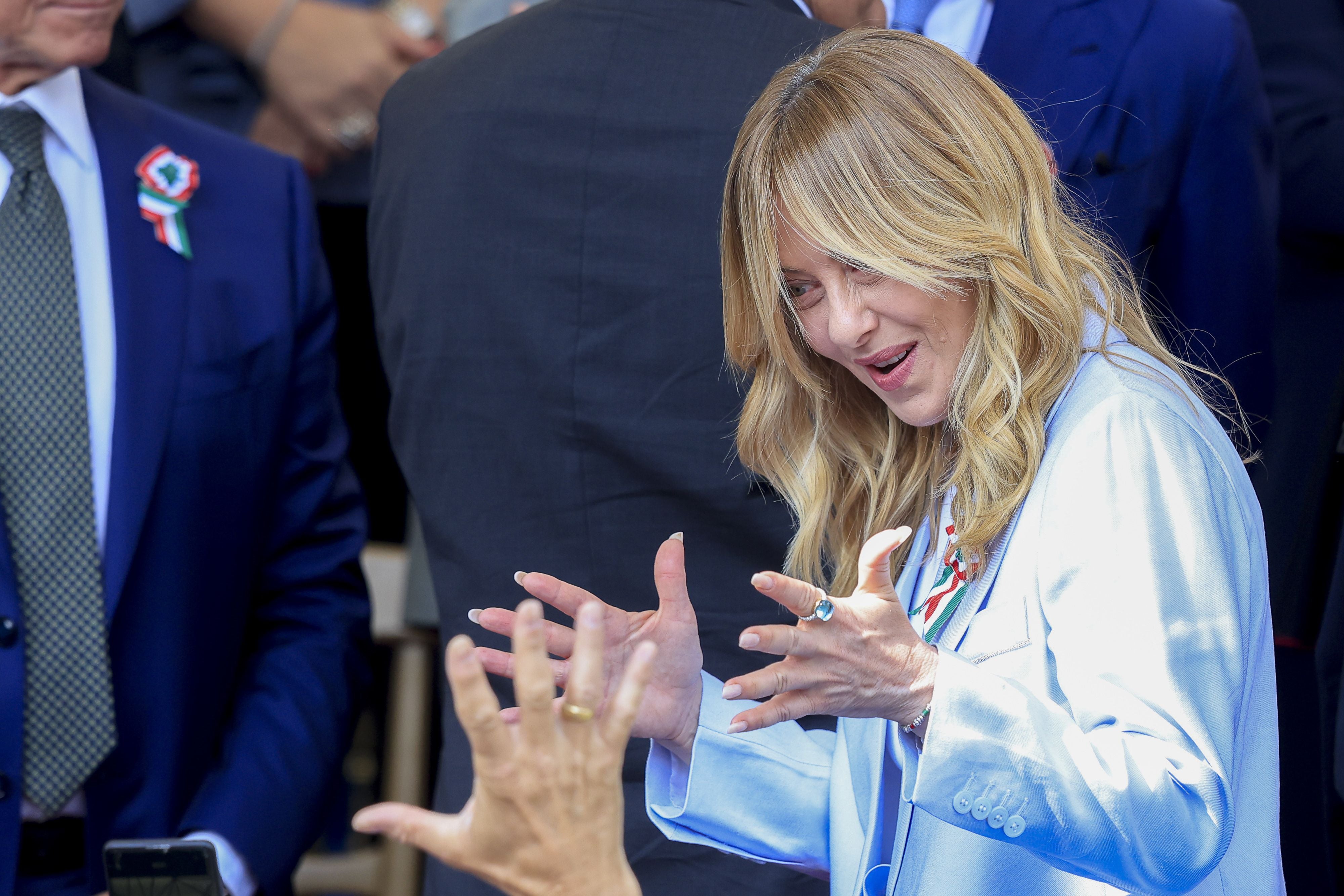 ROME, ITALY - JUNE 02: Italian Prime Minister Giorgia Meloni greets participants before the start of a military parade marking the 80th anniversary of the Italian Republic in Rome, Italy, on June 2, 2026. (Photo by Riccardo De Luca/Anadolu via Getty Images)