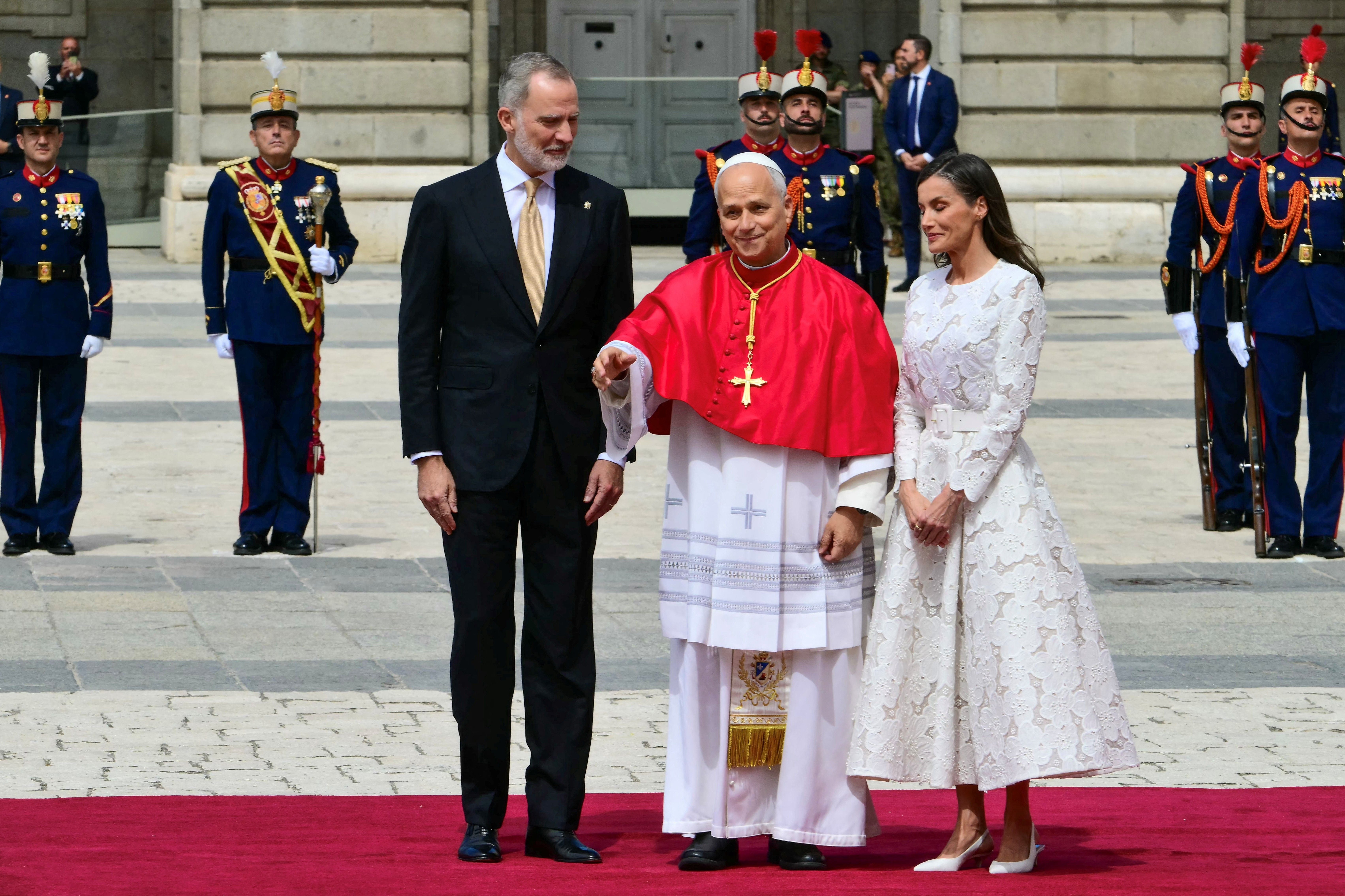 Spain's Felipe VI and Queen Letizia welcome Pope Leo XIV at the Royal Palace in Madrid on June 6, 2026. Pope Leo XIV is visiting Spain June 6-12 with stops in Madrid, Barcelona, and the Canary Islands, where he will meet with migrants and organisations dedicated to helping them. (Photo by Stefano RELLANDINI / AFP)