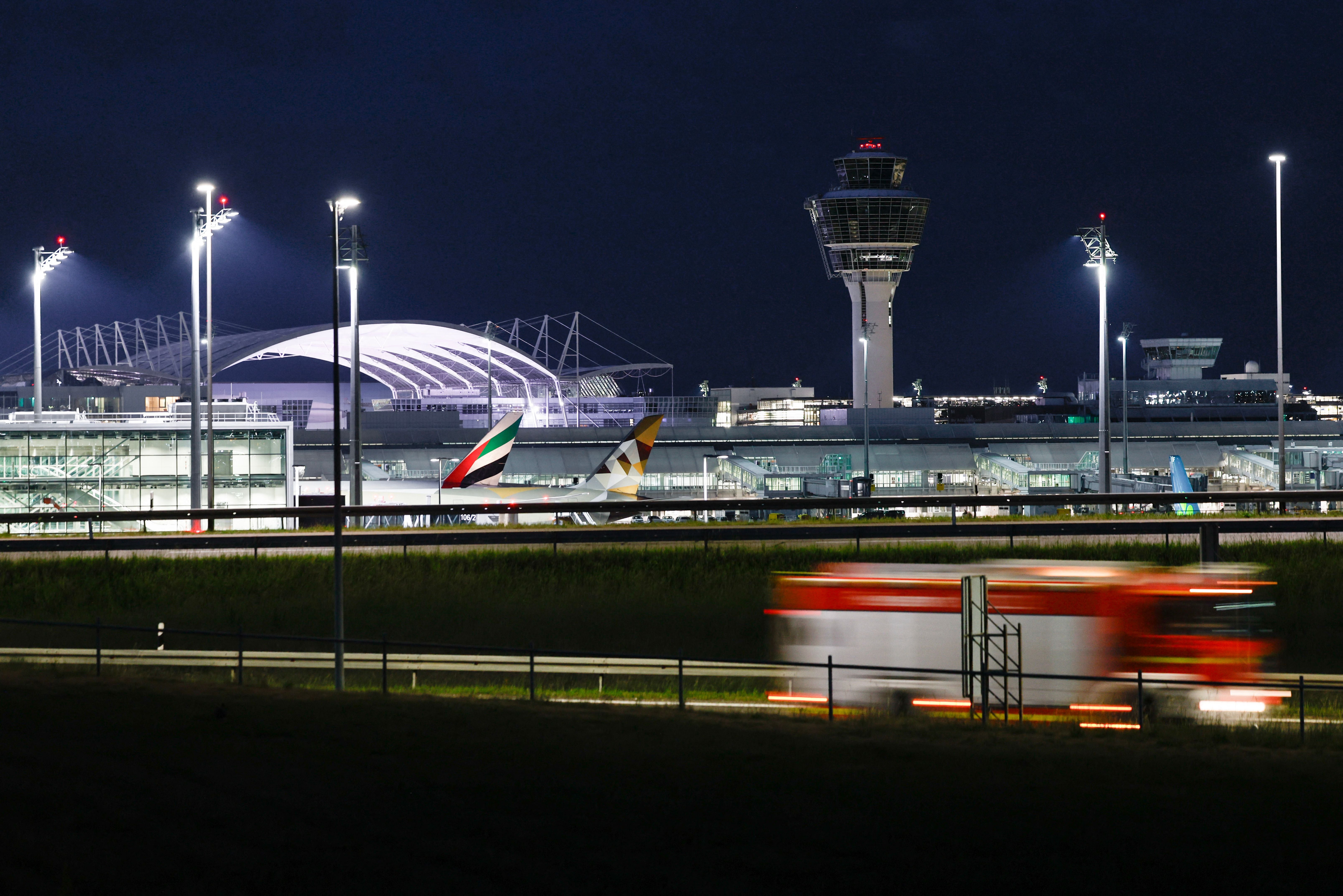 The tower is seen at the Munich International Airport in Munich, southern Germany,as a fire engine drives past on June 7, 2026. All flight operations were halted and the tower evacuated as staff reported strong smell of smoke but no fire has been detected. (Photo by Michaela STACHE / AFP)
