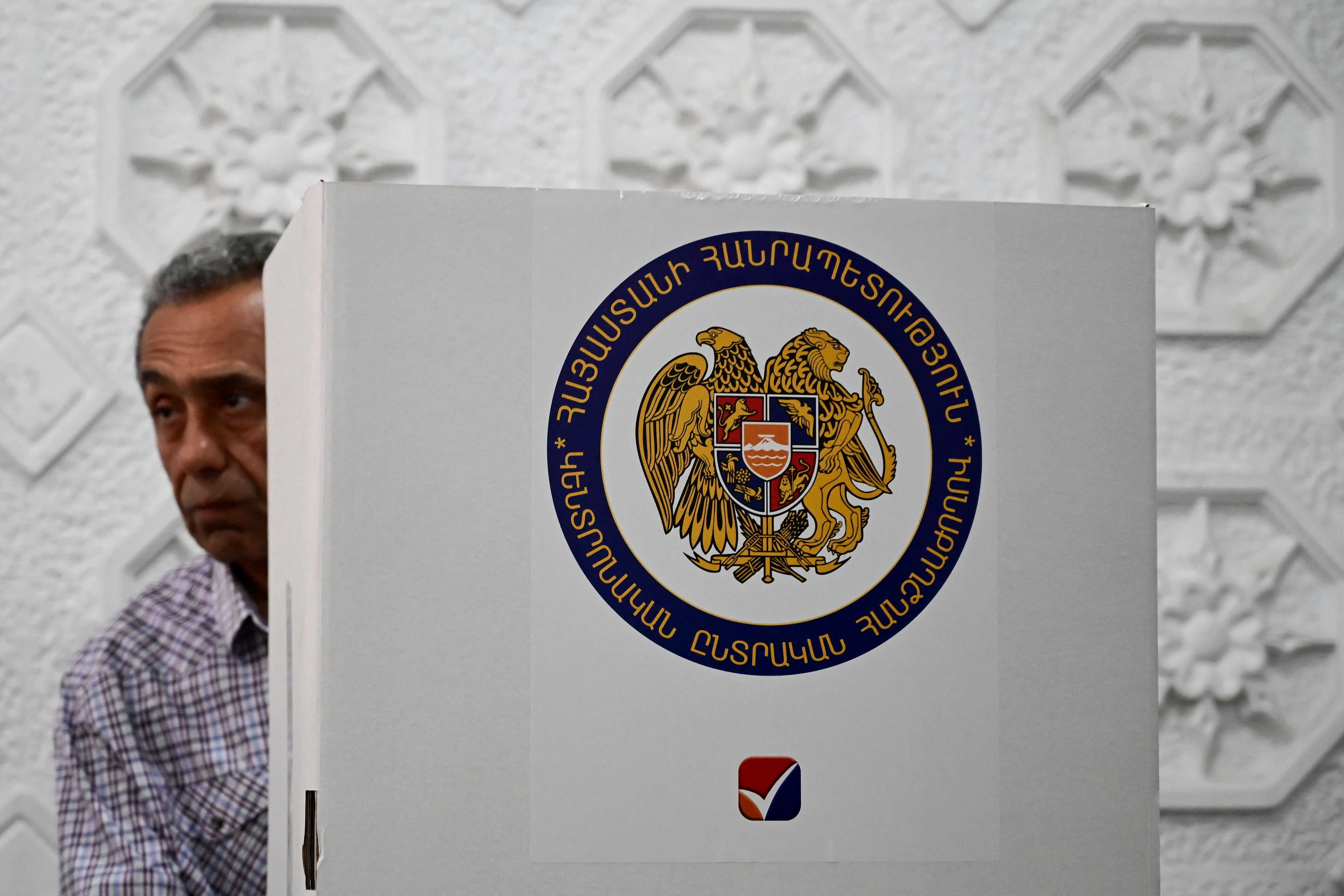 A man votes in Armenia's parliamentary election at a polling station in Yerevan on June 7, 2026. (Photo by Karen MINASYAN / AFP)
