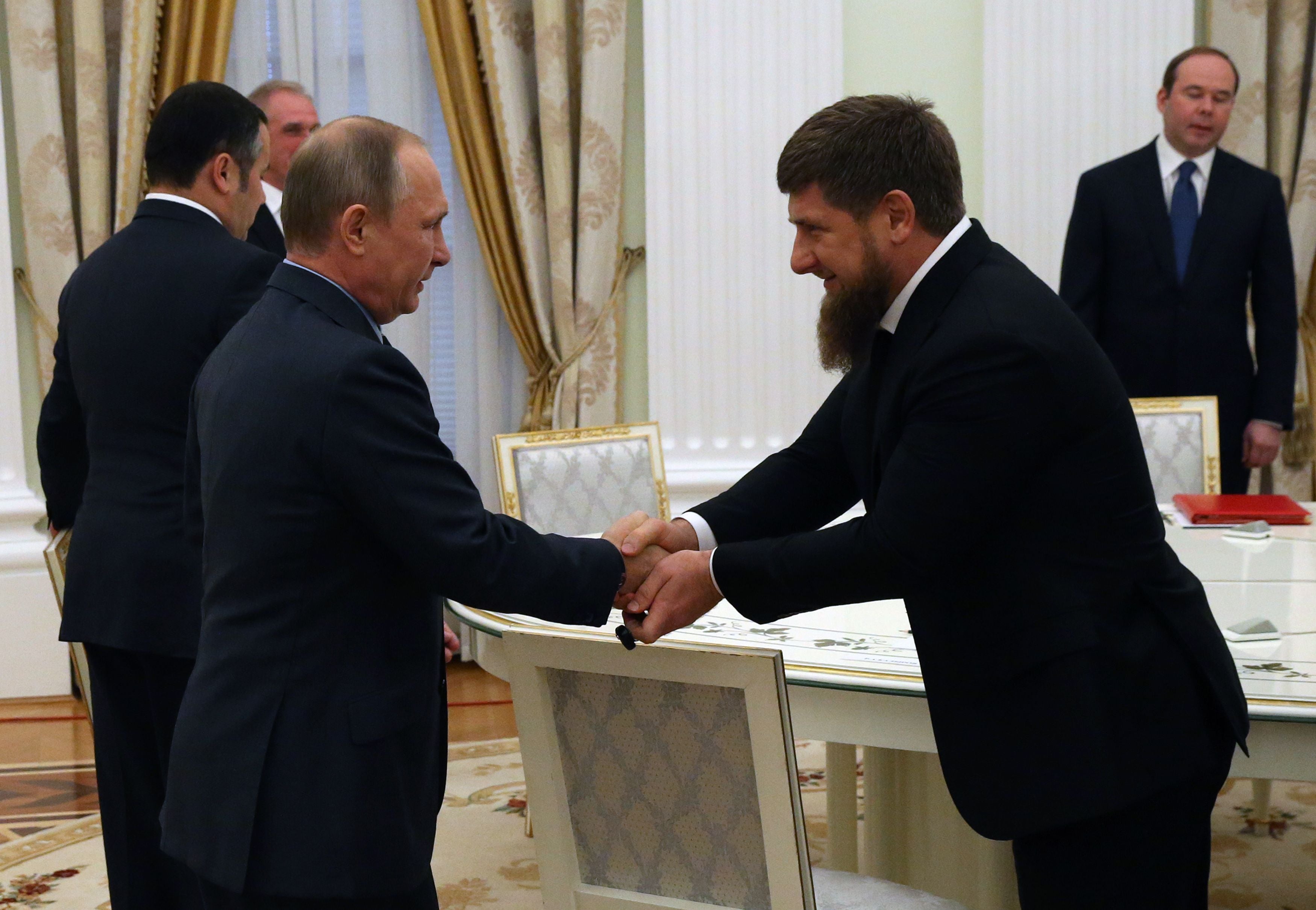 MOSCOW, RUSSIA - SEPTEMBER 23: (RUSSIA OUT) Russian President Vladimir Putin (L) greets Head of Chechnya Ramzan Kadyrov (R) during his meeting with newly elected governors at the Kremlin on September, 23, 2016 in Moscow, Russia. Putin has received new governors who won their elections held last Sunday. (Photo by Mikhail Svetlov/Getty Images)