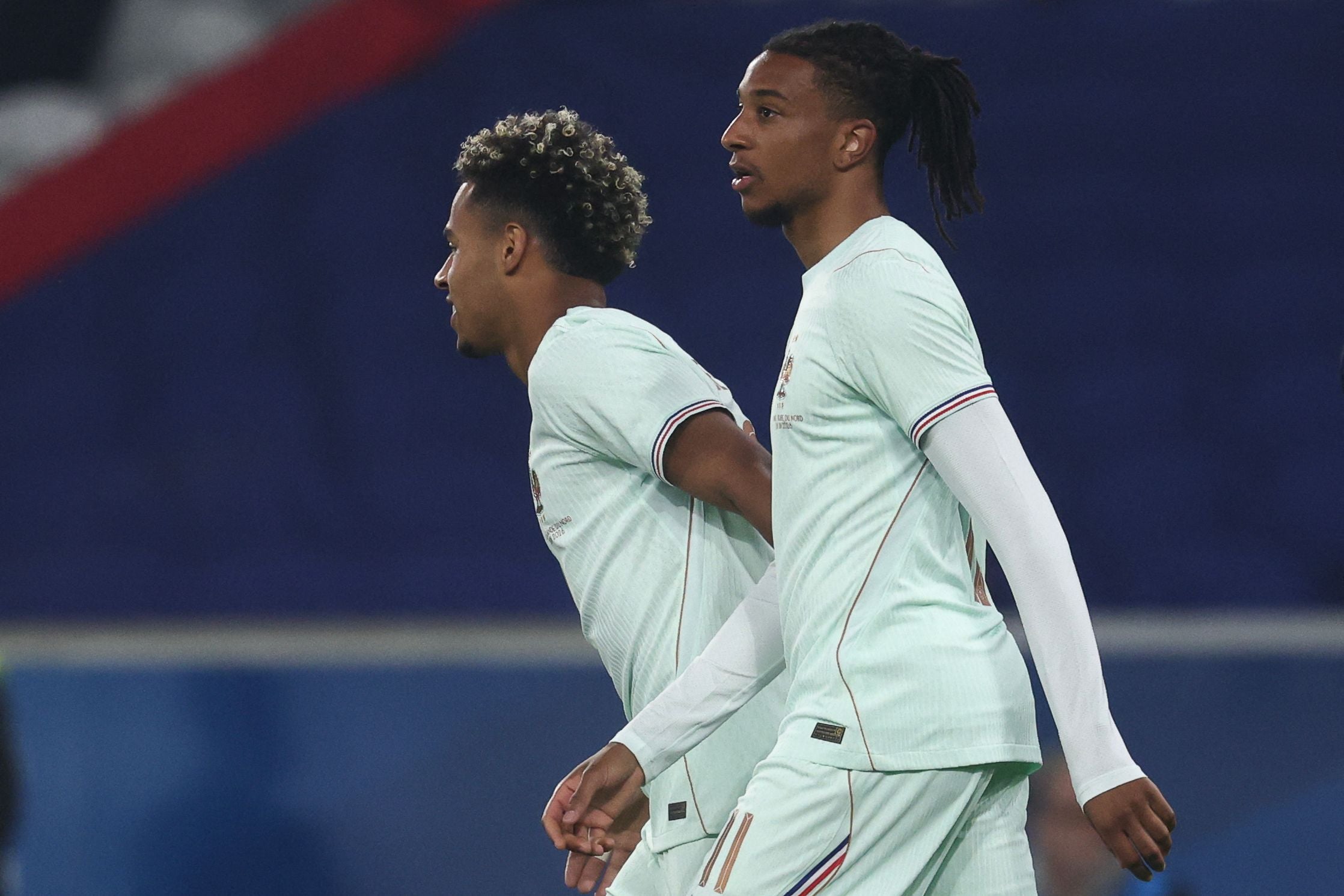 France's forward #11 Michael Olise celebrates scoring his team's second goal with France's forward #20 Desire Doue (L) during the international friendly football match between France and North Ireland at the Decathlon Arena - Pierre Mauroy stadium in Villeneuve-d'Ascq, northern France on June 8, 2026, ahead of the 2026 FIFA World Cup football tournament. (Photo by FRANCK FIFE / AFP)