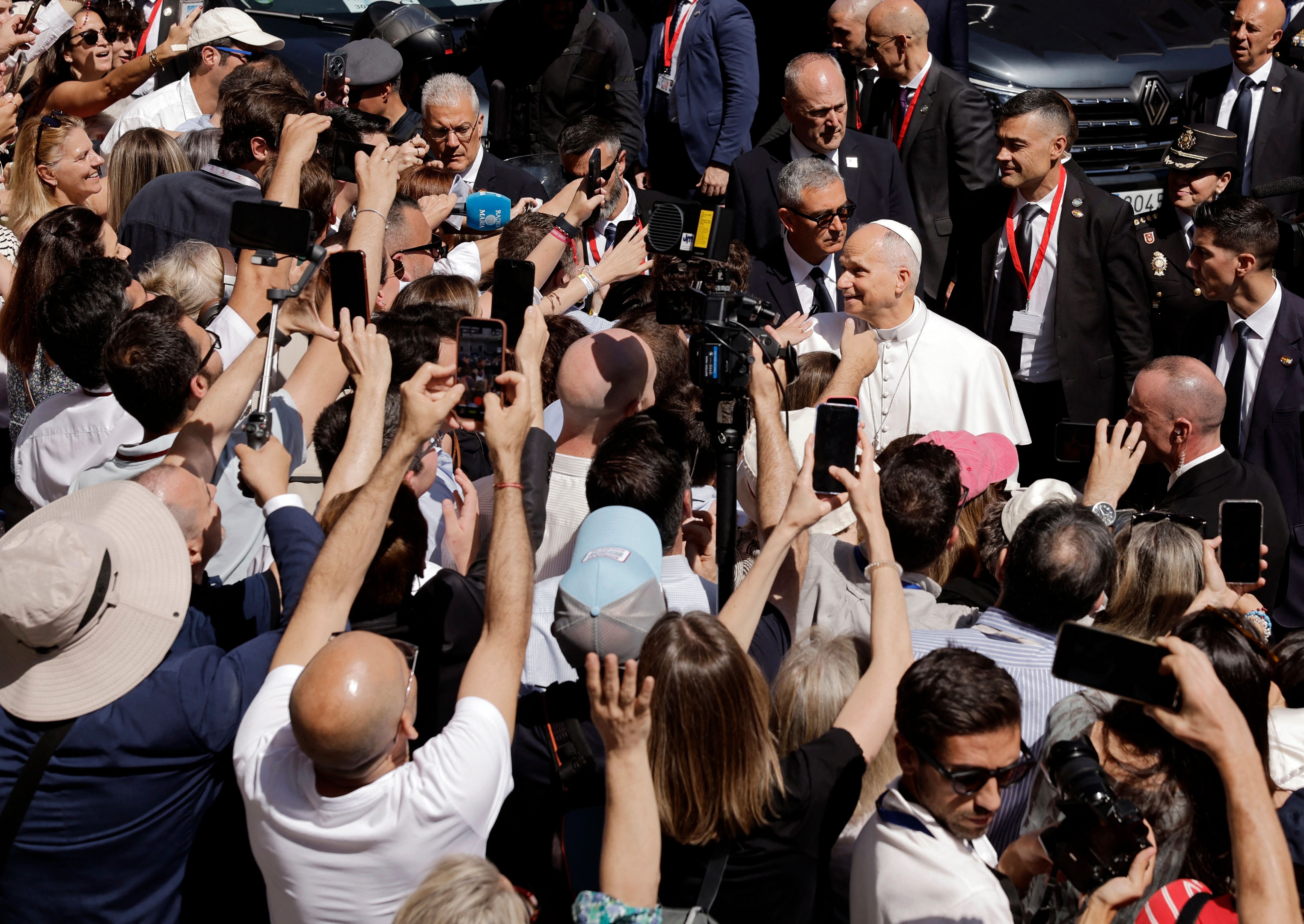Pope Leo XIV greets people as he leaves the Congress of Deputies after delivering a speech to a joint session of the Spanish Parliament in Madrid on June 8, 2026. Pope Leo XIV is visiting Spain June 6-12 with stops in Madrid, Barcelona, and the Canary Islands, where he will meet with migrants and organisations dedicated to helping them. (Photo by Oscar DEL POZO / AFP)