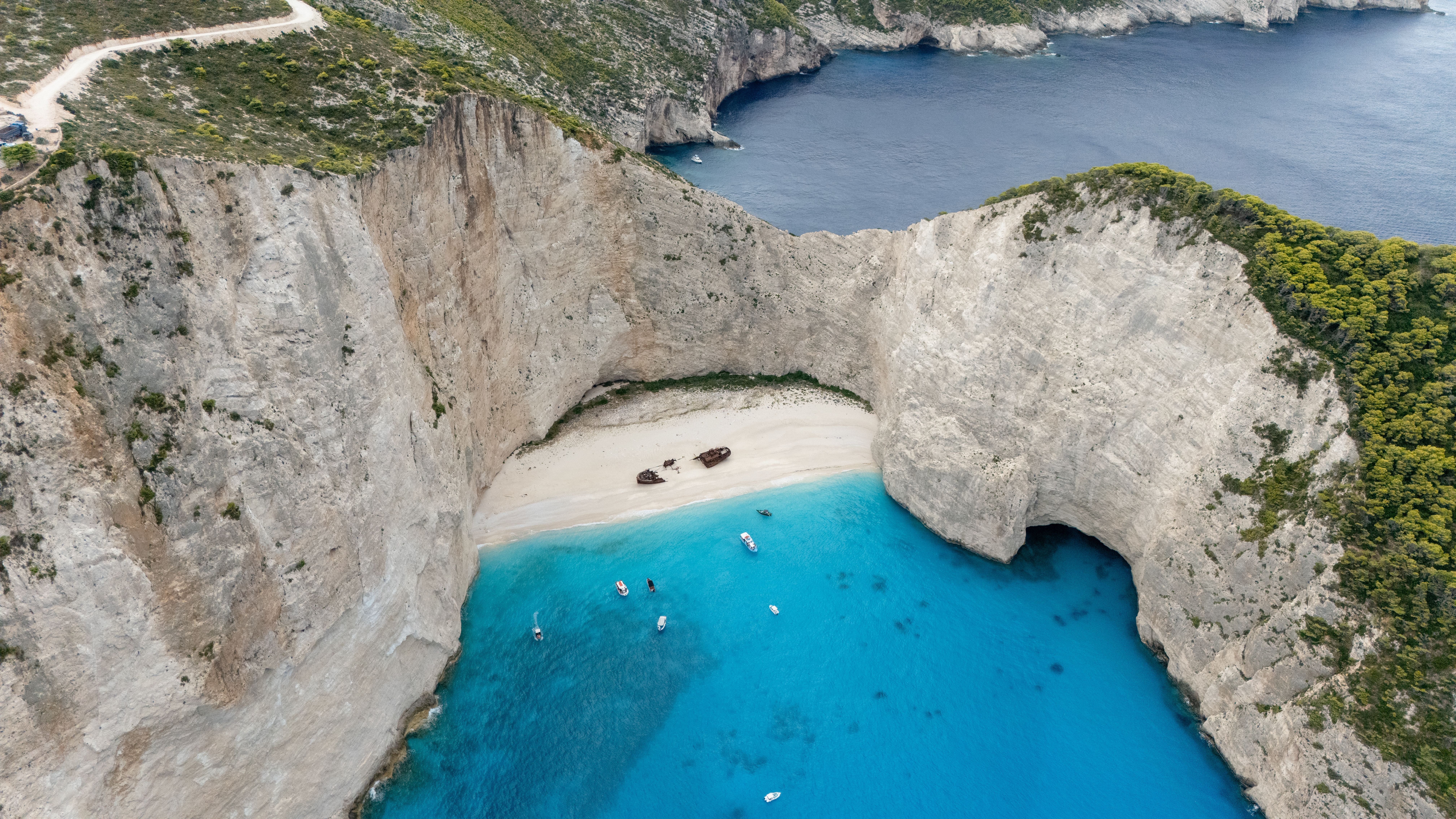 A drone view of the shipwreck of the MV Panagiotis at Navagio Beach, also known as Shipwreck Beach, on the island of Zakynthos, Greece, on September 11, 2025. (Photo by Manuel Romano/NurPhoto via Getty Images)