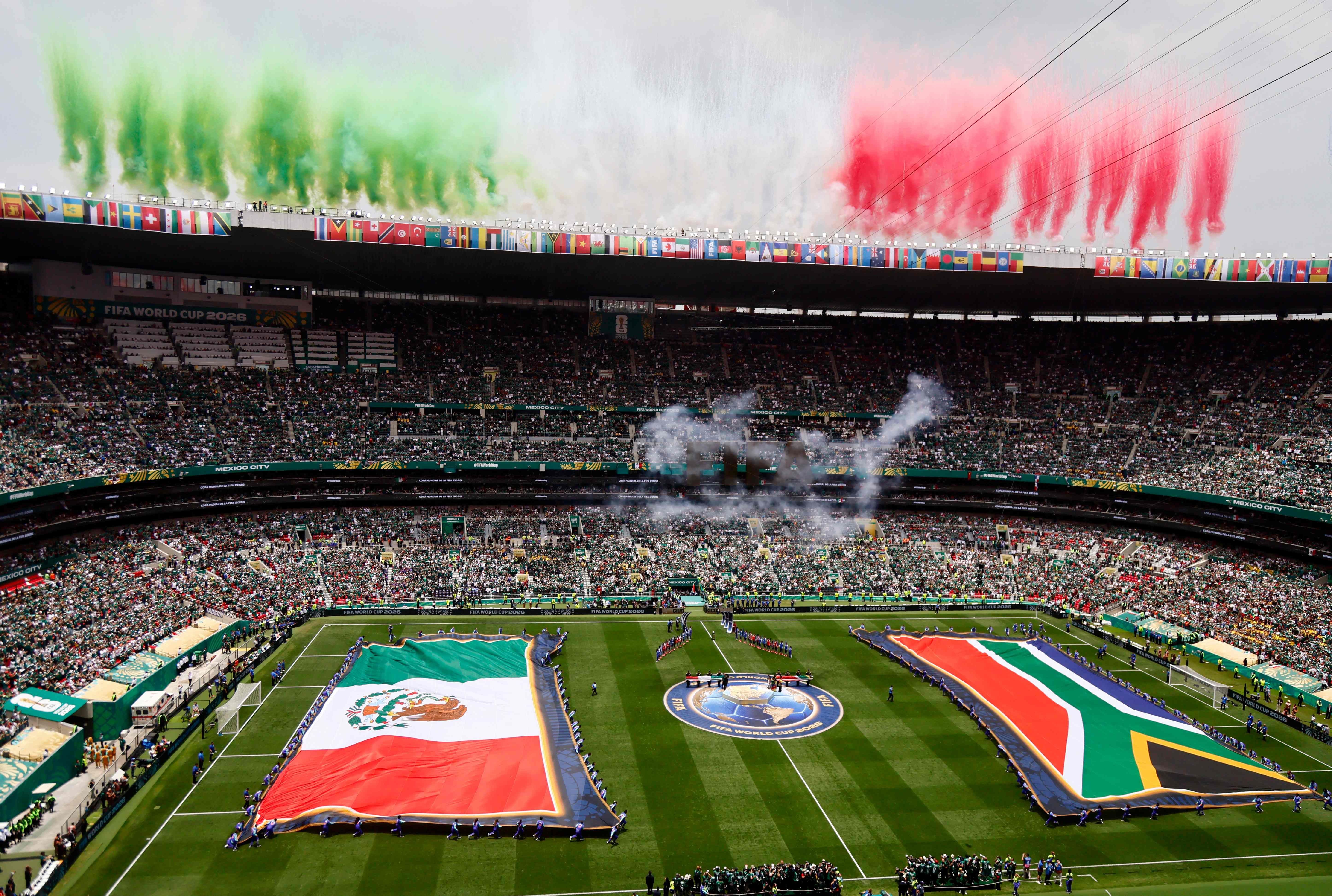 Mexican and South African players line up during during the 2026 World Cup Group A football match between Mexico and South Africa at the Mexico City Stadium in Mexico City on June 11, 2026. (Photo by Rodrigo OROPEZA / AFP)