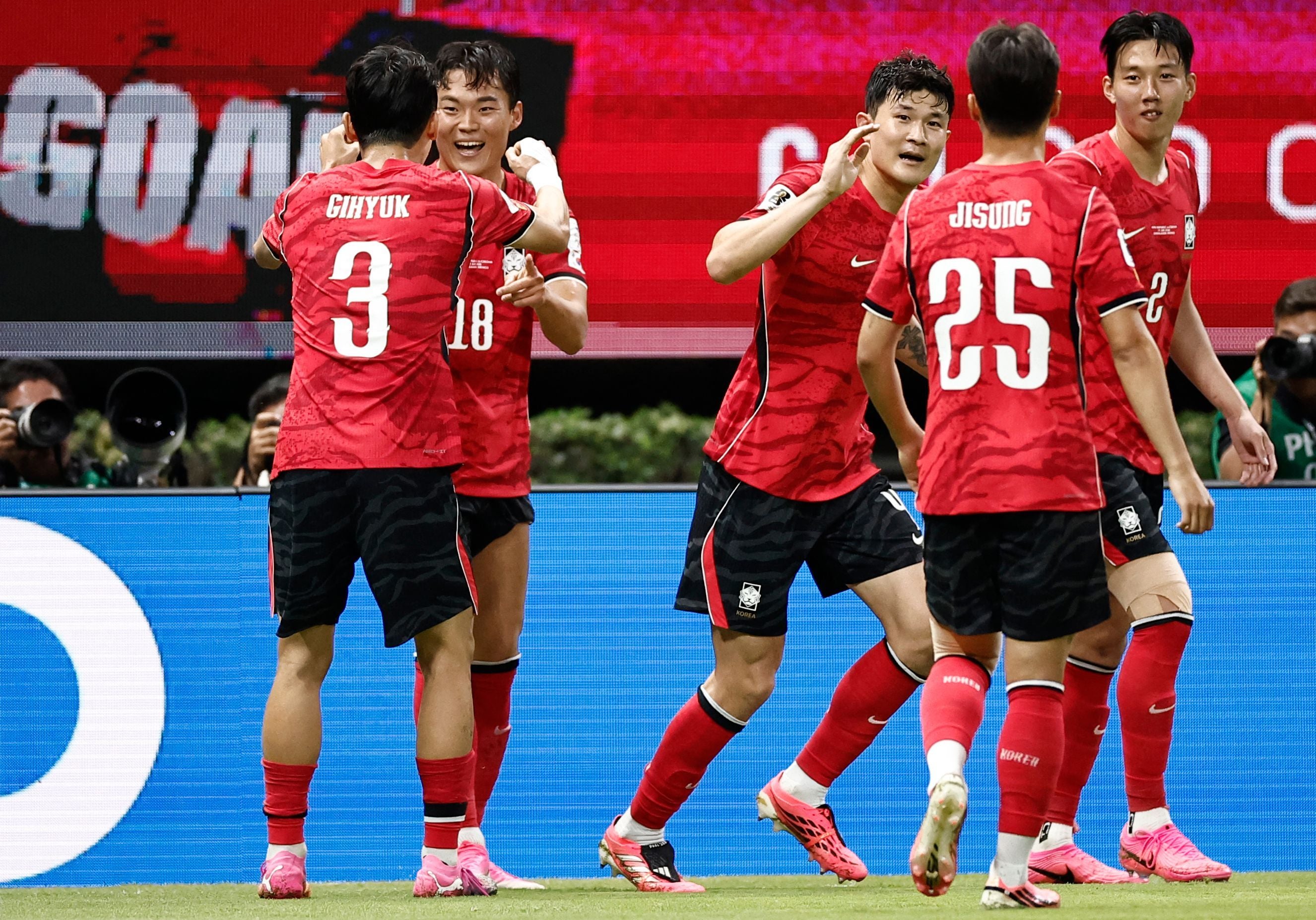 South Korea's forward #18 Oh Hyeon-gyu celebrates with teammate defender #03 Lee Gi-hyuk scoring his team's second goal during the 2026 World Cup Group A football match between South Korea and the Czech Republic at the Guadalajara Stadium in Zapopan on June 11, 2026. (Photo by Ulises RUIZ / AFP)
