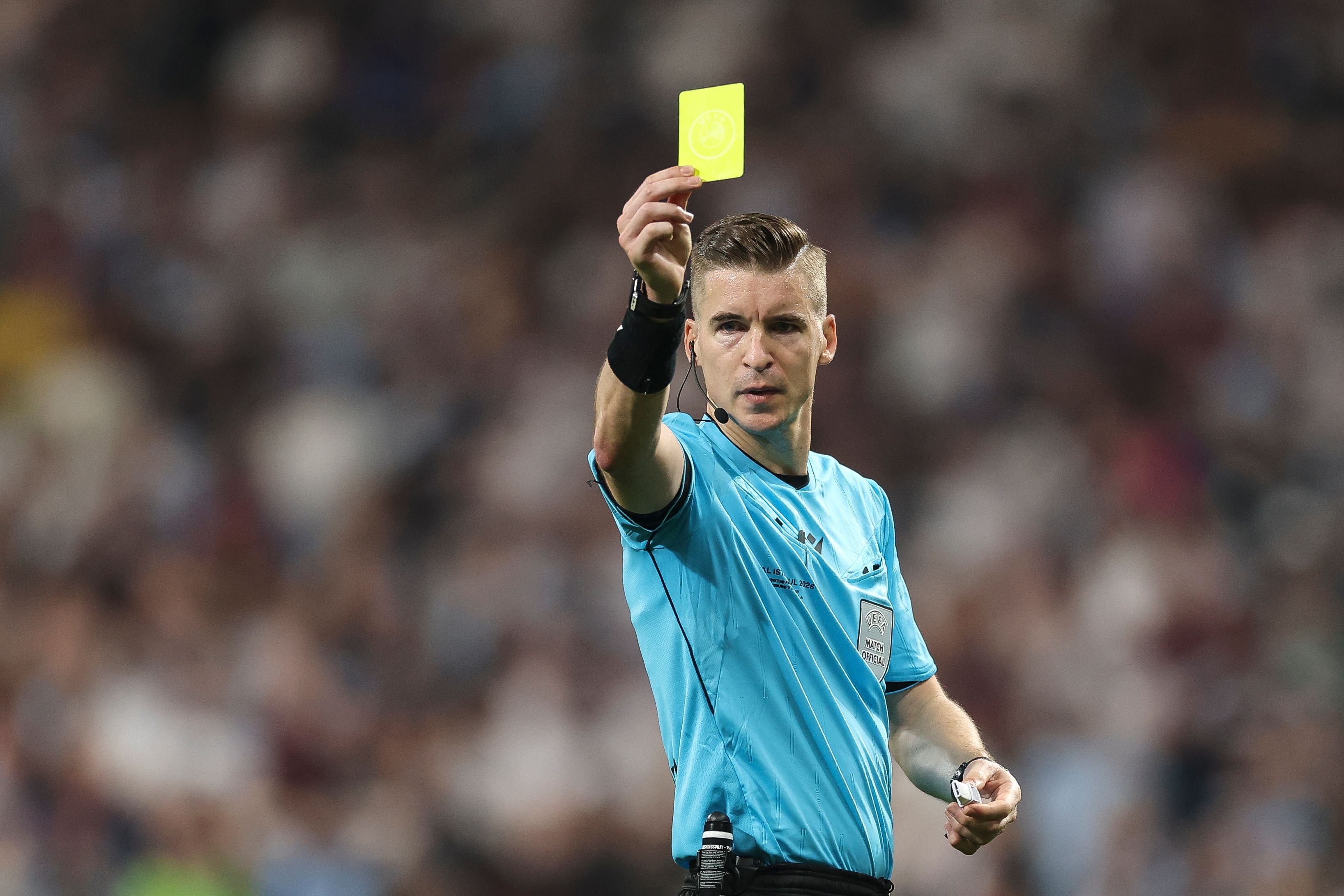 ISTANBUL, TURKEY - MAY 20: Referee Francois Letexier shows a yellow card during the UEFA Europa League Final 2026 match between SC Freiburg and Aston Villa FC at Besiktas Park on May 20, 2026 in Istanbul, Turkey. (Photo by Maja Hitij/Getty Images)