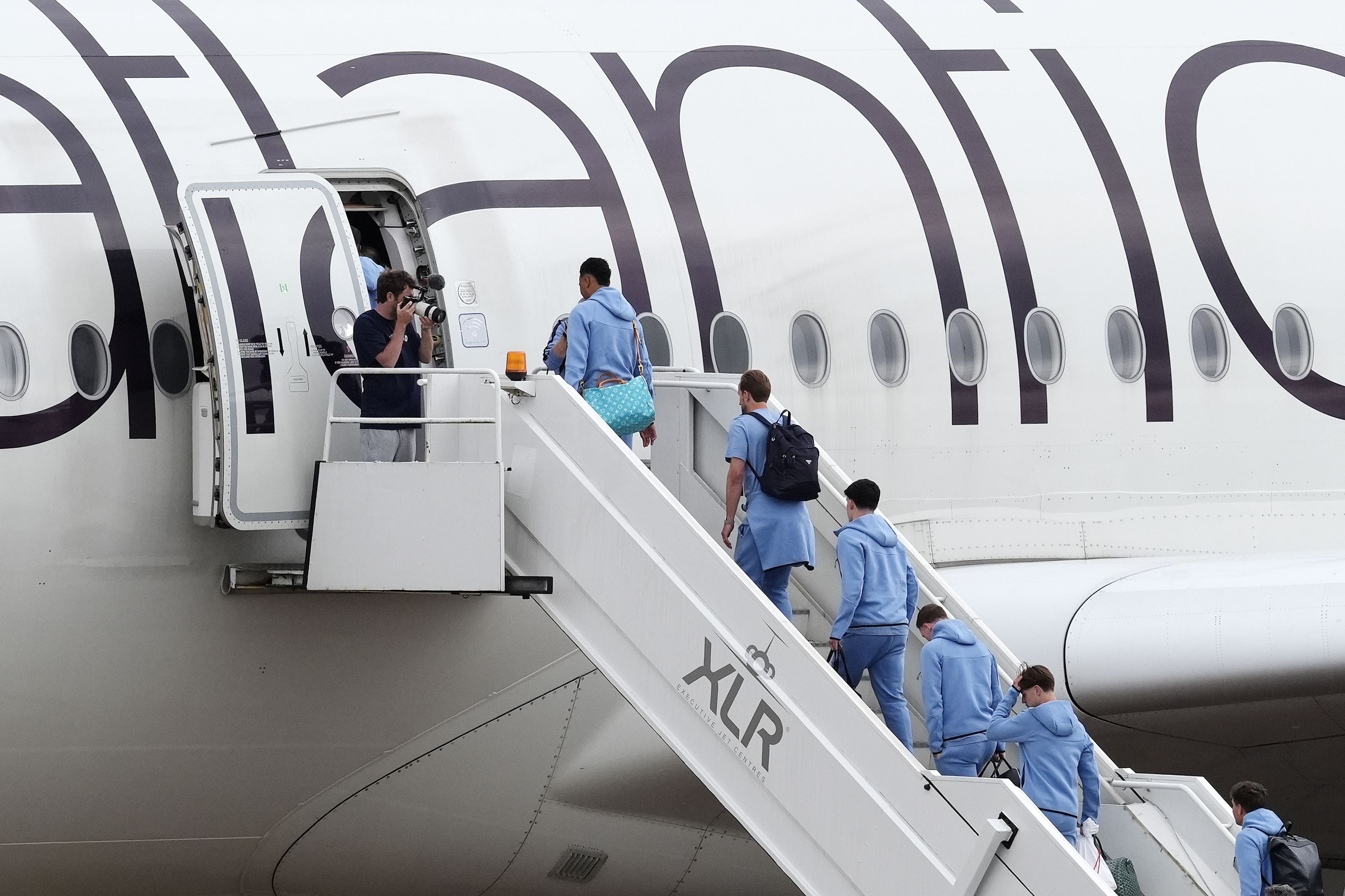 England's Harry Kane (centre right), Ollie Watkins (centre left) and team-mates boarding a plane at Birmingham Airport ahead of the team's departure to the United States where they will face Croatia, Ghana and Panama in the FIFA World Cup. Picture date: Monday June 1, 2026. (Photo by Nick Potts/PA Images via Getty Images)