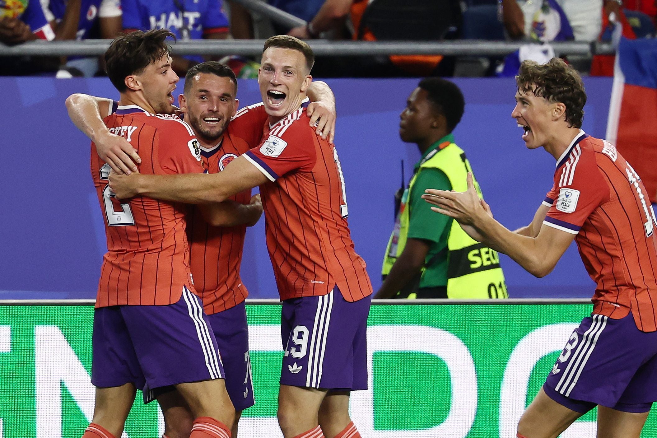 Scotland's midfielder #07 John McGinn (2nd L) celebrates with teammates after scoring his team's first goal during the 2026 World Cup Group C football match between Haiti and Scotland at the Boston Stadium in Foxborough on June 13, 2026. (Photo by FRANCK FIFE / AFP)