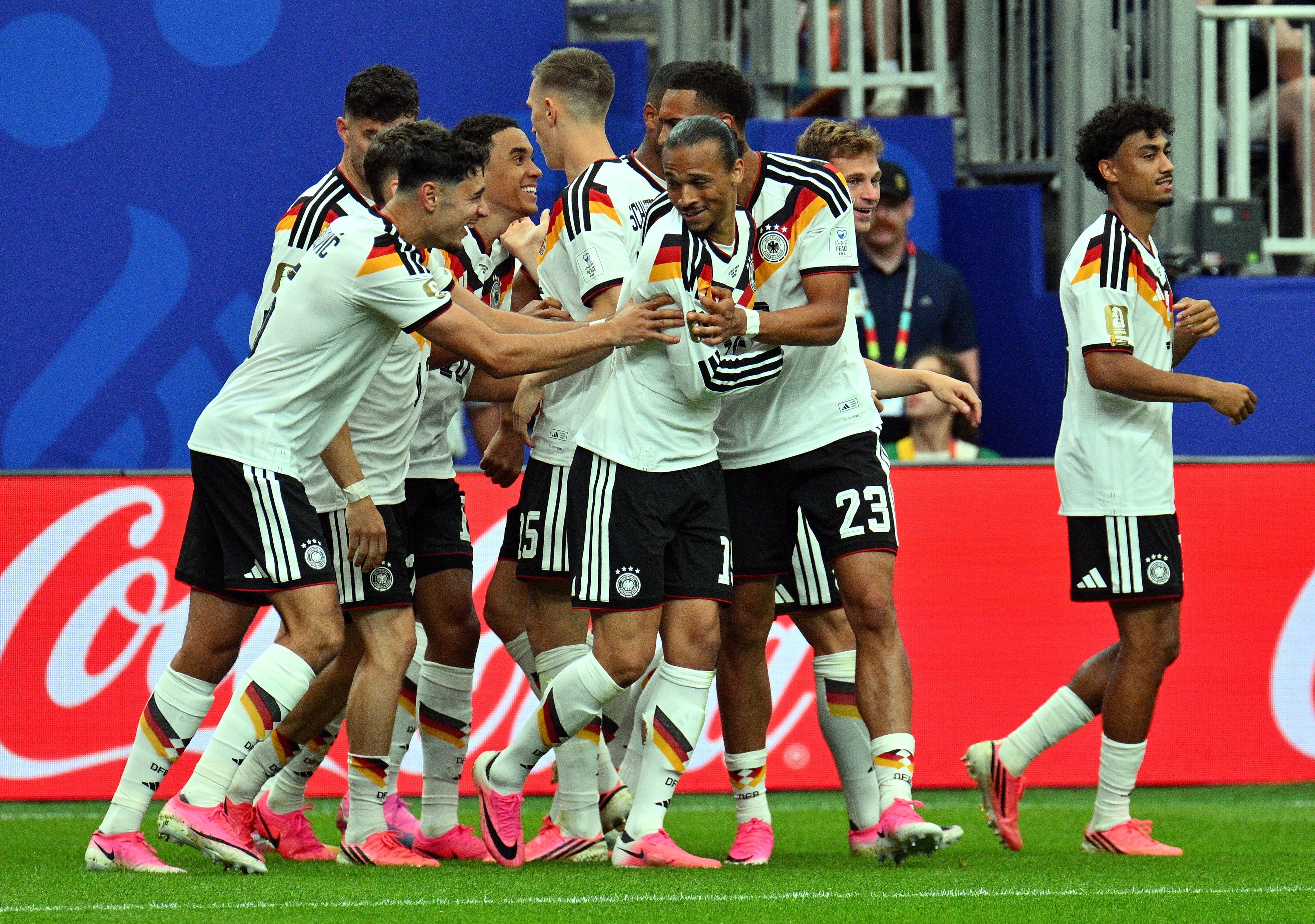 Germany's defender #18 Nathaniel Brown (C) celebrates with teammates after scoring his team's fifth goal during the 2026 World Cup Group E football match between Germany and Curacao at the Houston Stadium in Houston on June 14, 2026. (Photo by RONALDO SCHEMIDT / AFP)