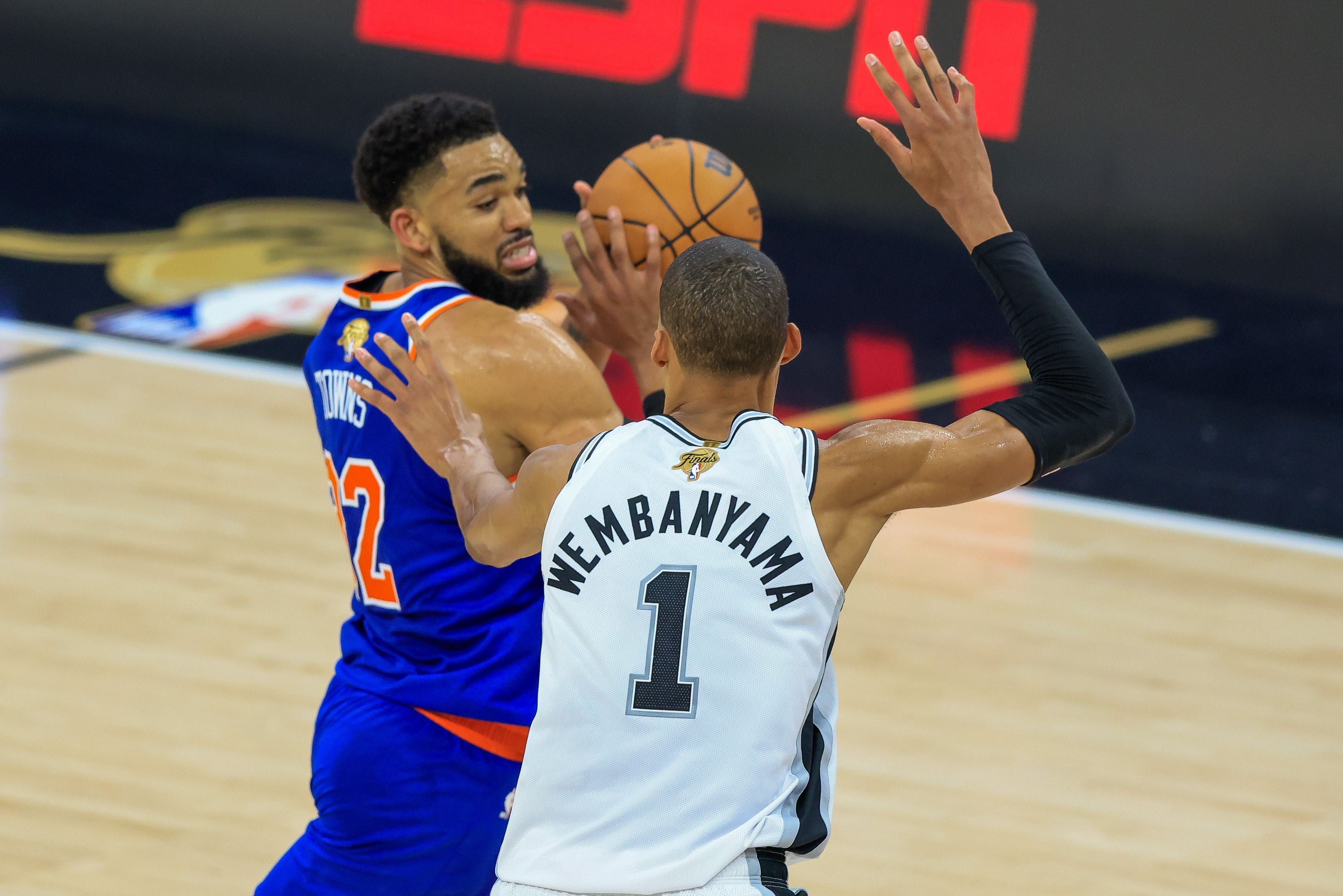 epa13035652 New York Knicks center Karl-Anthony Towns (L) in action against San Antonio Spurs forward Victor Wembanyama (1) during Game 5 of the NBA Finals between the San Antonio Spurs and the New York Knicks in San Antonio, Texas, USA, 13 June 2026. EPA/ADAM DAVIS SHUTTERSTOCK OUT