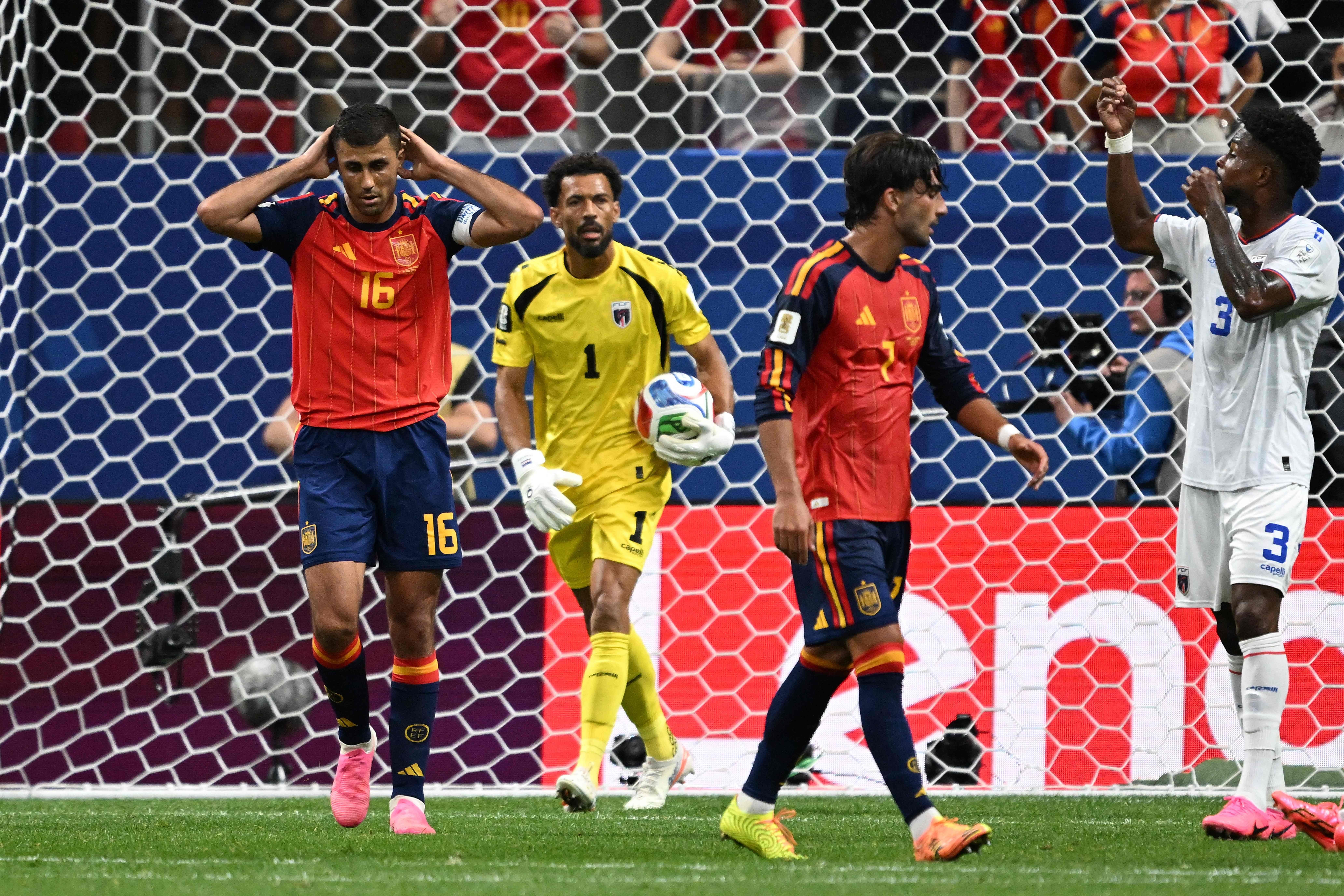 Spain's midfielder #16 Rodri (L) reacts after next to Cape Verde's goalkeeper #01 Vozinha (C) after missing a goal opportunity during the 2026 World Cup Group H football match between Spain and Cape Verde at the Atlanta Stadium in Atlanta on June 15, 2026. (Photo by Roberto SCHMIDT / AFP)