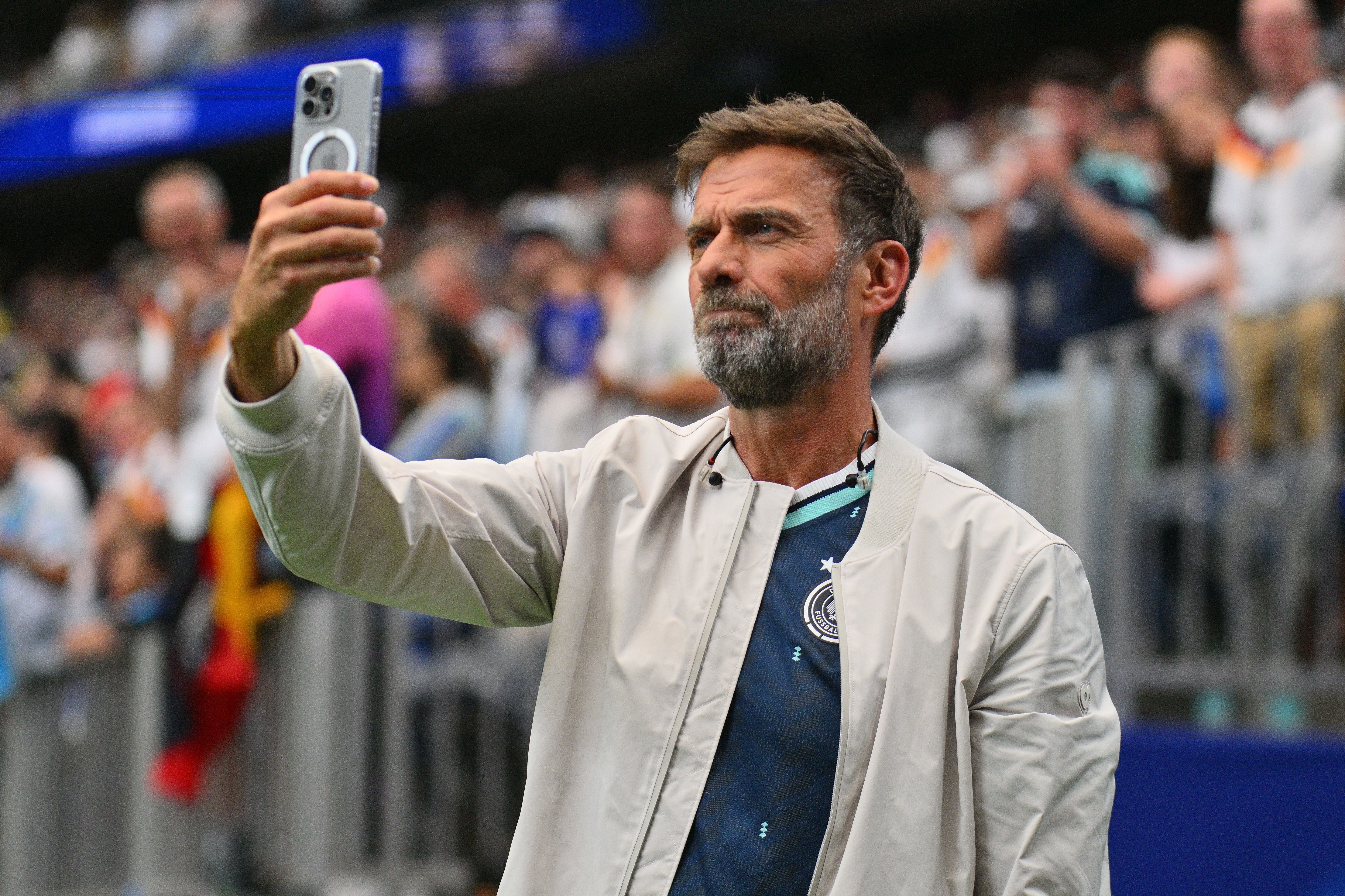 epa13037074 Former German soccer coach Juergen Klopp takes a selfie after FIFA World Cup 2026 group stage match Germany against Curacao, in Houston, USA, 14 June 2026. EPA/SAM WASSON