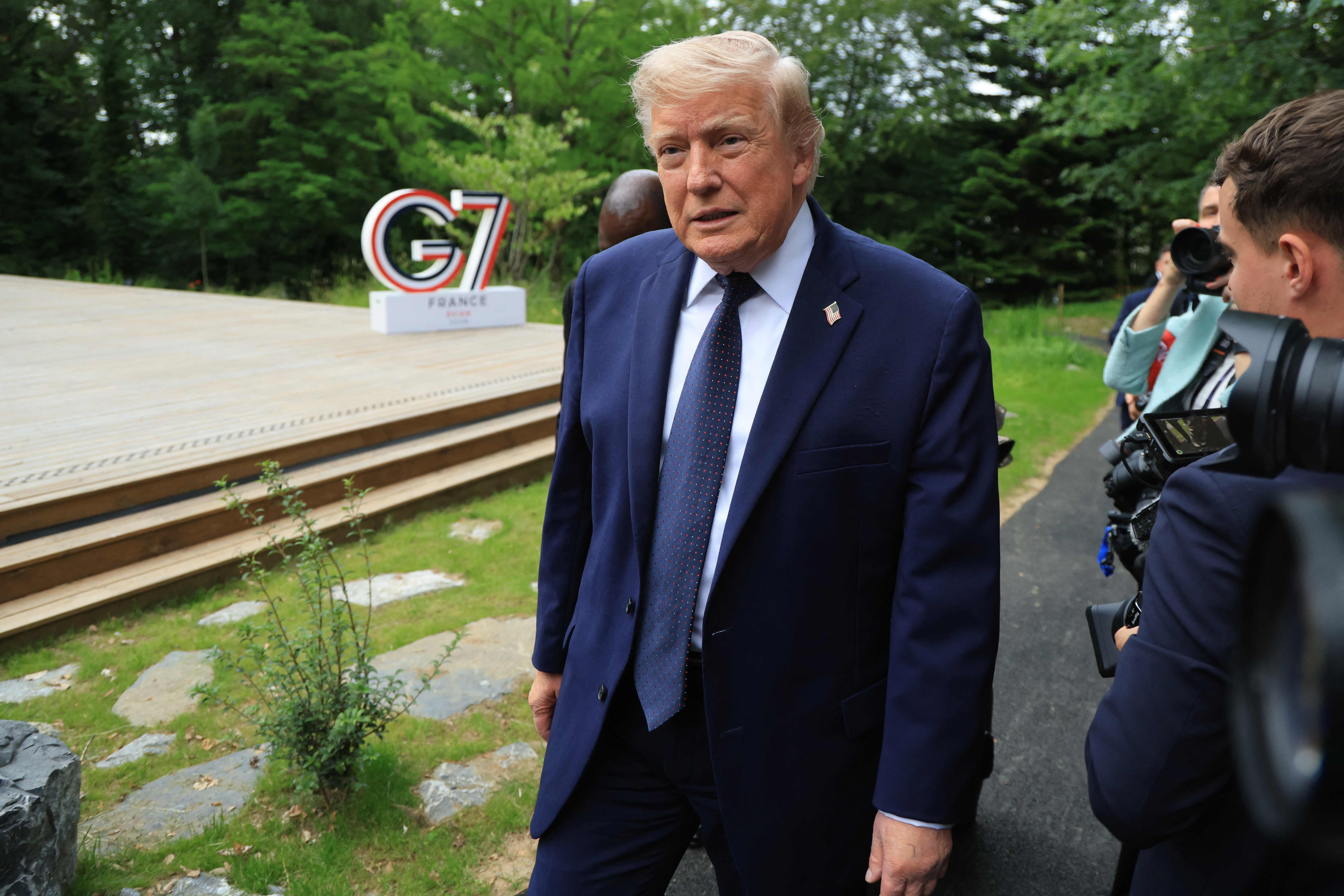 US President Donald Trump arrives to attend a musical interlude before a gala dinner as part of the G7 summit, in Evian, eastern France, on June 16, 2026. A G7 summit is set to take place June 15 to 17 in the French town of Evian-les-Bains near Switzerland and it will be attended by country leaders as well as the EU's foreign policy chief and ministers from Brazil, Canada, the United Arab Emirates and Turkey. (Photo by Ludovic MARIN / POOL / AFP)