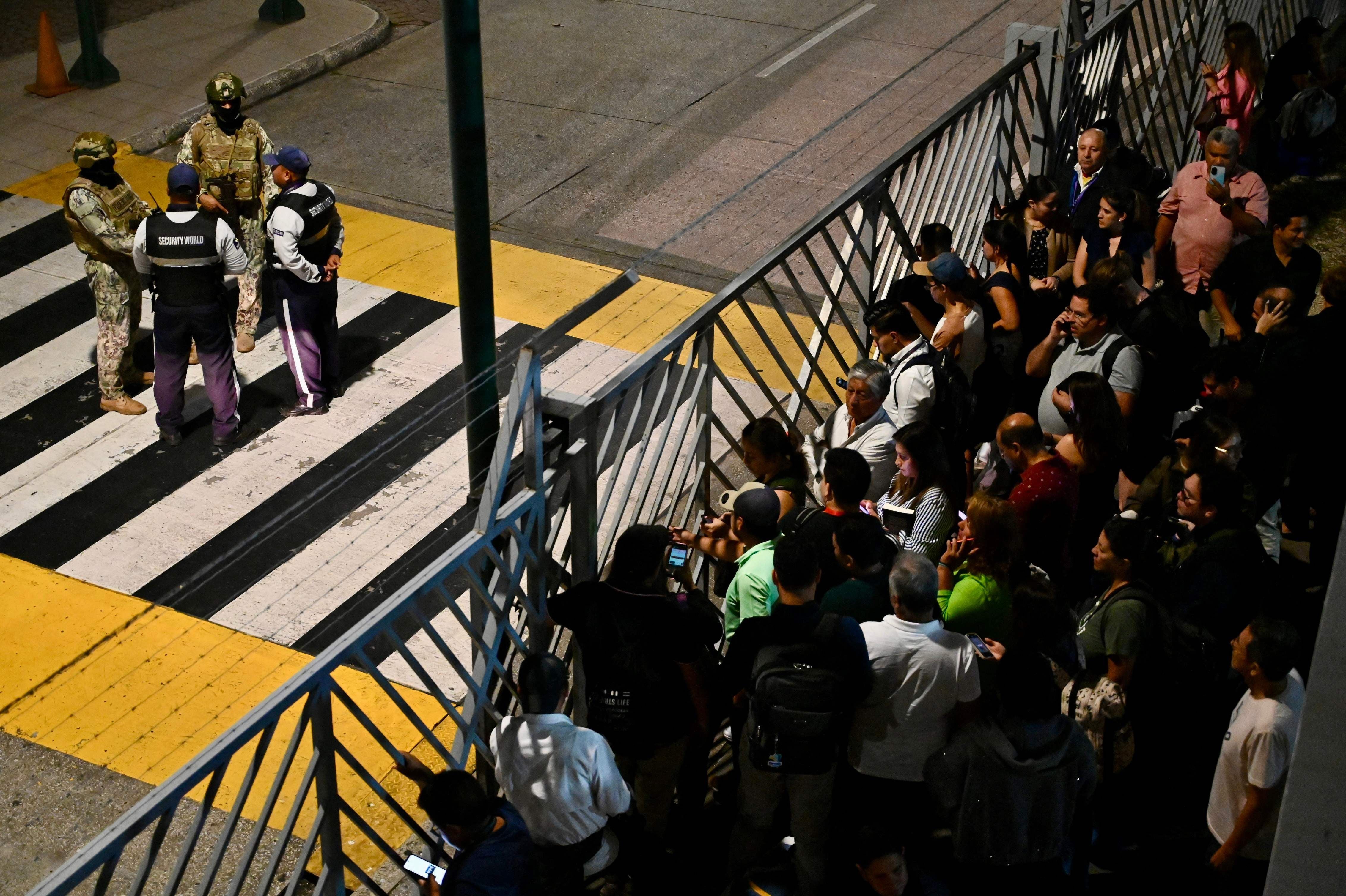 Members of the army and airport security guard the exterior of the international arrivals area after a criminal gang leader was shot dead at Jose Joaquin de Olmedo International Airport in Guayaquil, Ecuador, on June 17, 2026. Ecuador's Interior Minister John Reimberg identified the deceased as Carlos Suastegui, leader of the Las Aguilas gang, an armed wing of the feared criminal group Los Choneros. (Photo by MARCOS PIN / AFP)