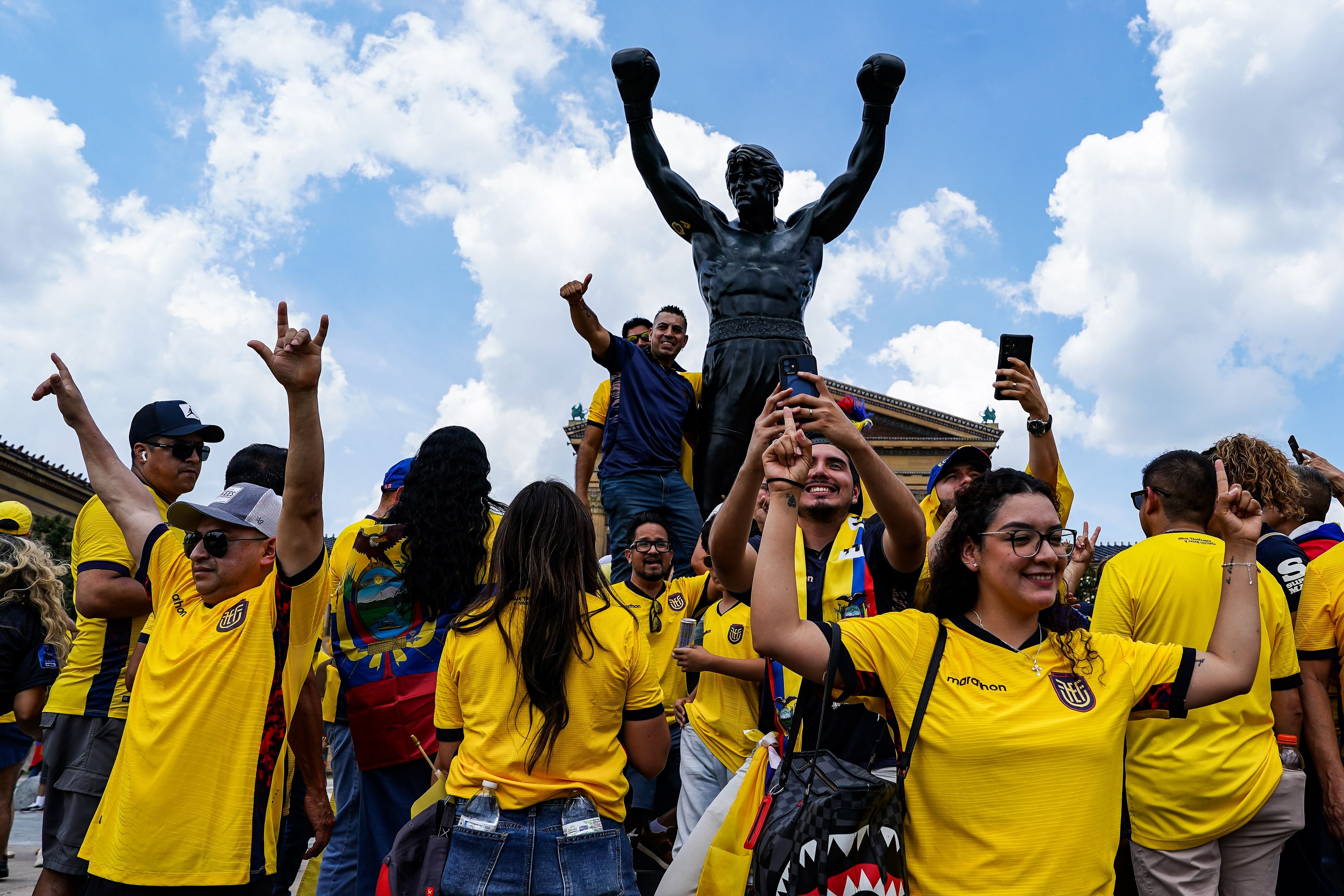 PHILADELPHIA, PENNSYLVANIA - JUNE 14: Fans of Ecuador gather in front of the Rocky Statue at the Rocky steps prior to the FIFA World Cup 2026 Group E match between Cote D'Ivoire and Ecuador at Philadelphia Stadium on June 14, 2026 in Philadelphia, Pennsylvania. (Photo by Daniela Porcelli/Getty Images)