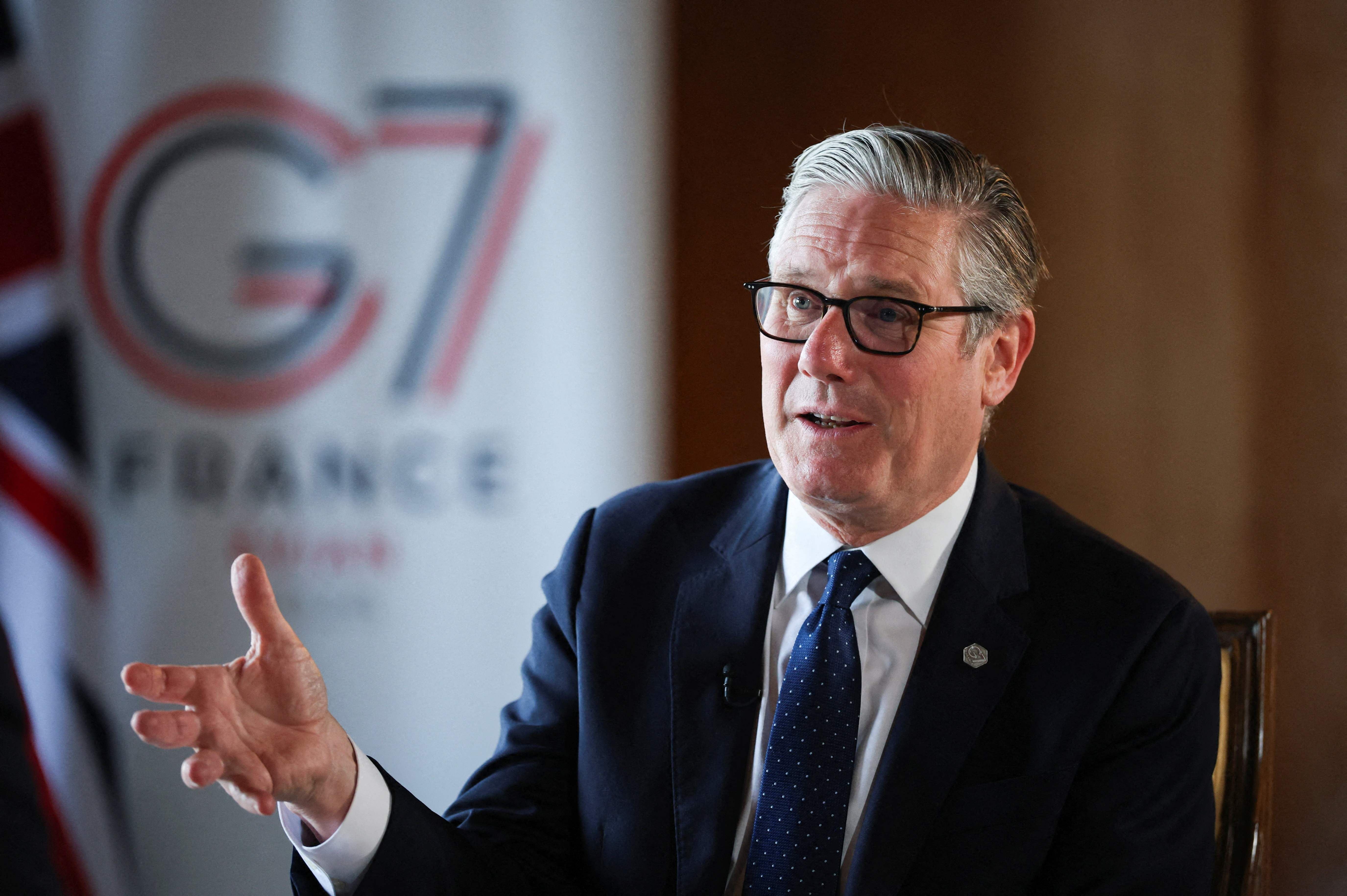 Britain's Prime Minister Keir Starmer speaks to members of the media on the sidelines of the G7 summit, in xThonon-les-Bains, on June 17, 2026. (Photo by Isabel Infantes / POOL / AFP)