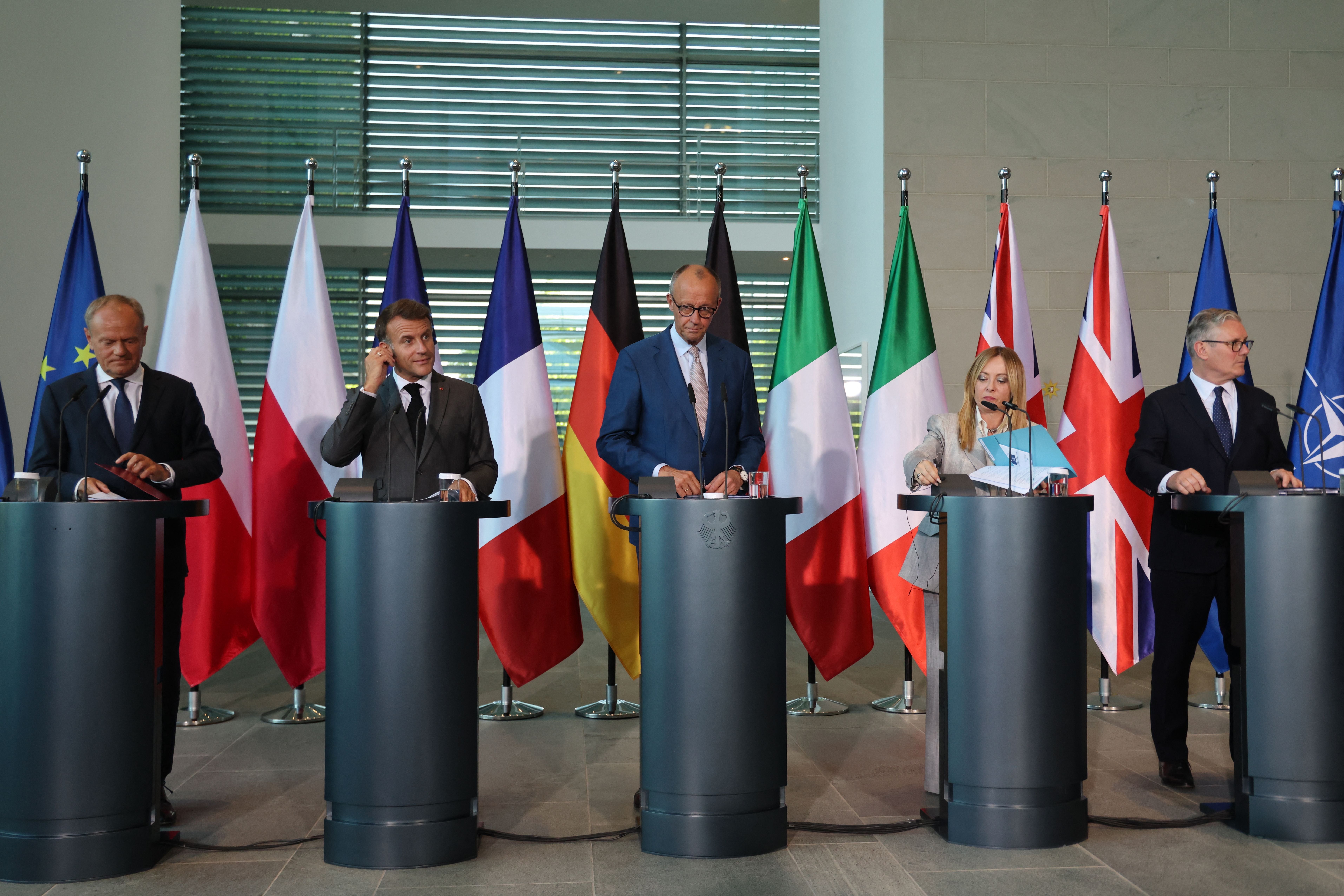 (L-R) Poland's Prime Minister Donald Tusk, France's President Emmanuel Macron, German Chancellor Friedrich Merz, Italy's Prime Minister Giorgia Meloni and Britain's Prime Minister Keir Starmer leave after the press at the end of their meeting of state leaders of the European Group of Five (E5) and the NATO Secretary General, on June 24, 2026 at the Chancellery in Berlin, Germany. (Photo by Ludovic MARIN / AFP)