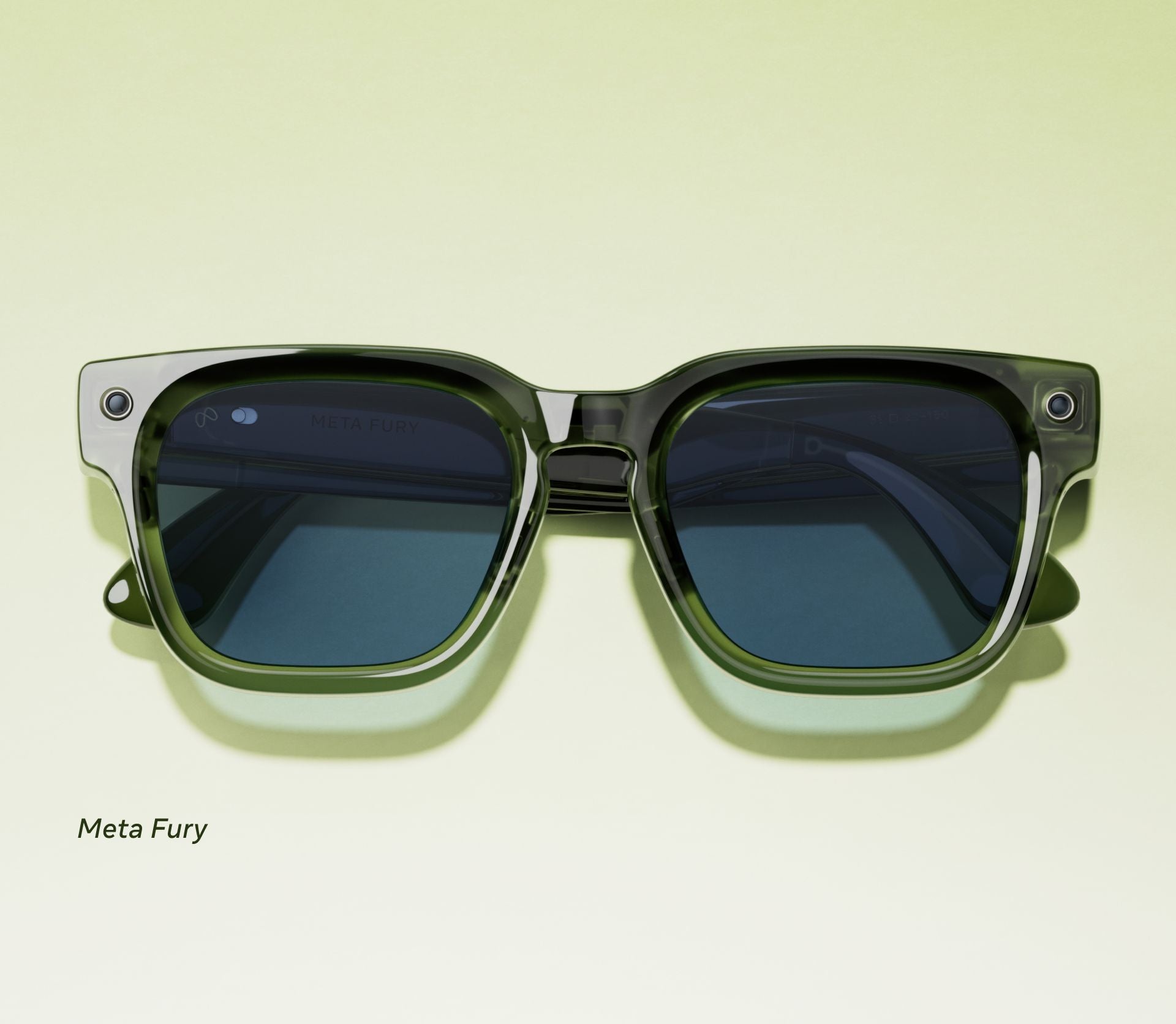 Grüne Meta-Sonnenbrille mit dunklen Gläsern auf hellem Hintergrund.