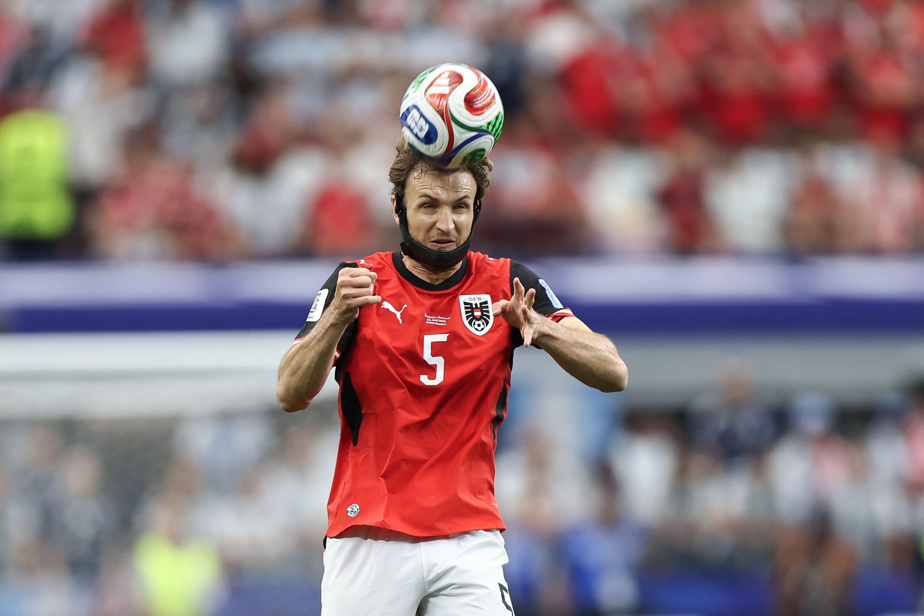 DALLAS, TEXAS - JUNE 22: Stefan Posch #5 of Austria heads the ball during the FIFA World Cup 2026 Group J match between Argentina and Austria at Dallas Stadium on June 22, 2026 in Dallas, Texas. (Photo by Omar Vega/Getty Images)