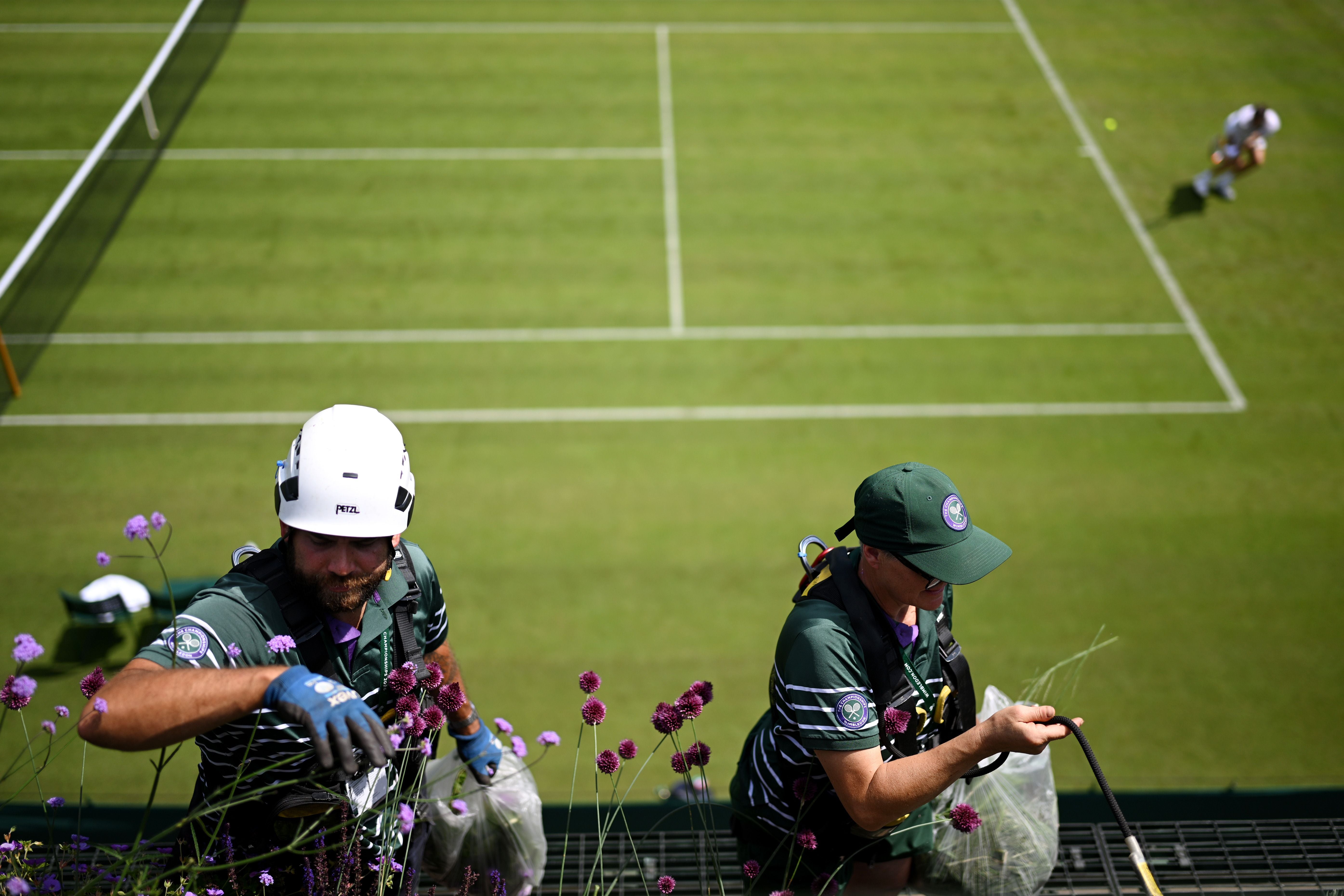 LONDON, ENGLAND - JUNE 27: Ground staff prepare the premises before The Championships Wimbledon 2026 at All England Lawn Tennis and Croquet Club on June 27, 2026 in London, England. (Photo by Matthias Hangst/Getty Images)