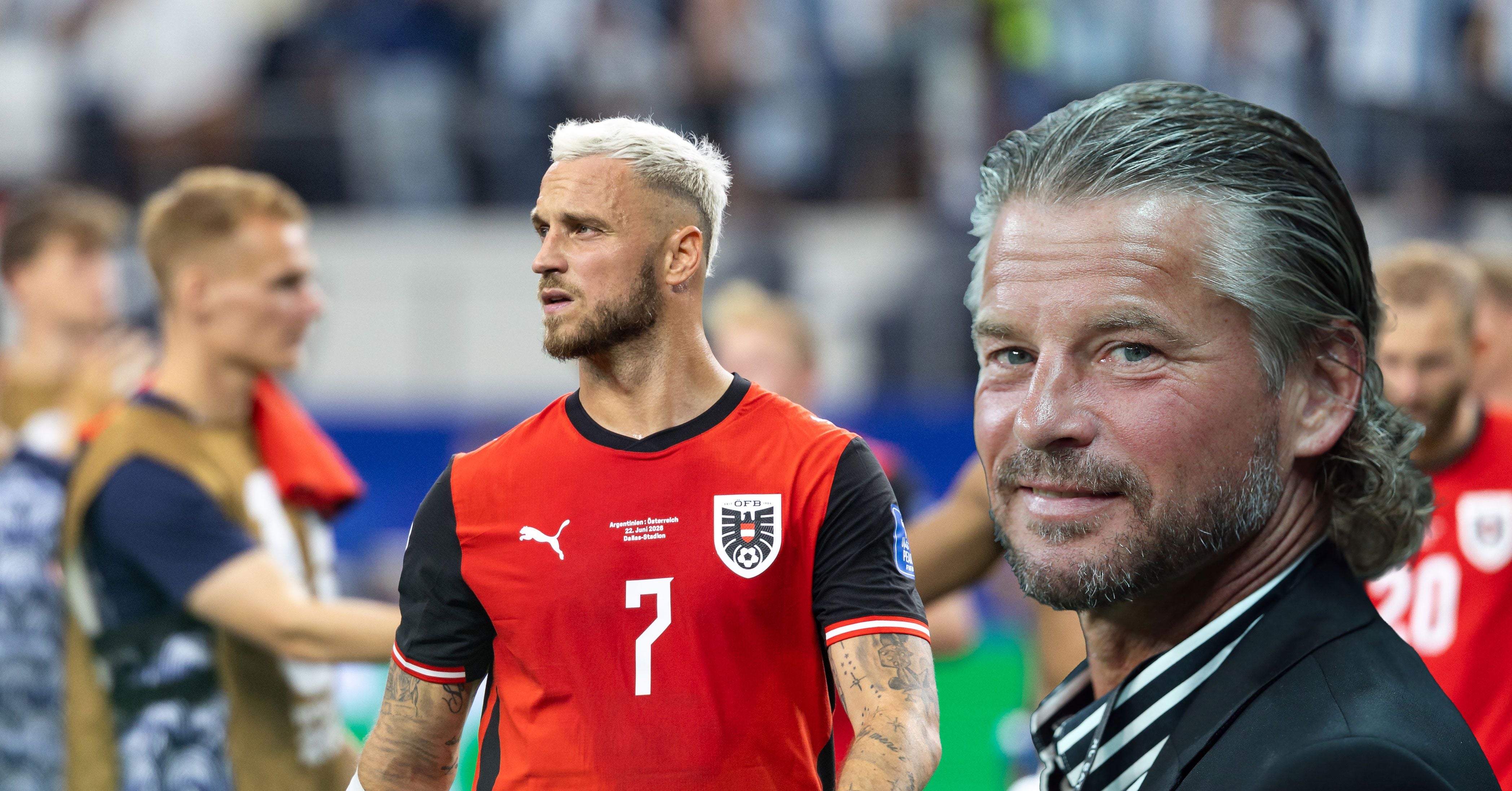 Ein Fußballspieler im roten Trikot und ein Mann im Anzug vor unscharfem Stadionhintergrund.